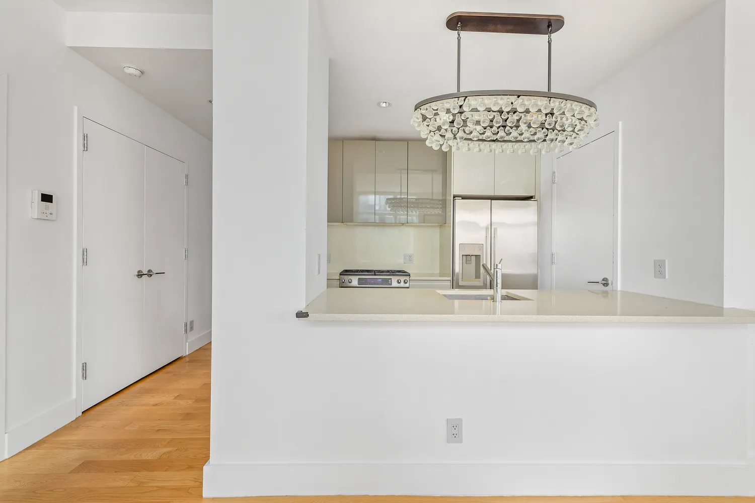 a view of a kitchen from a dining room