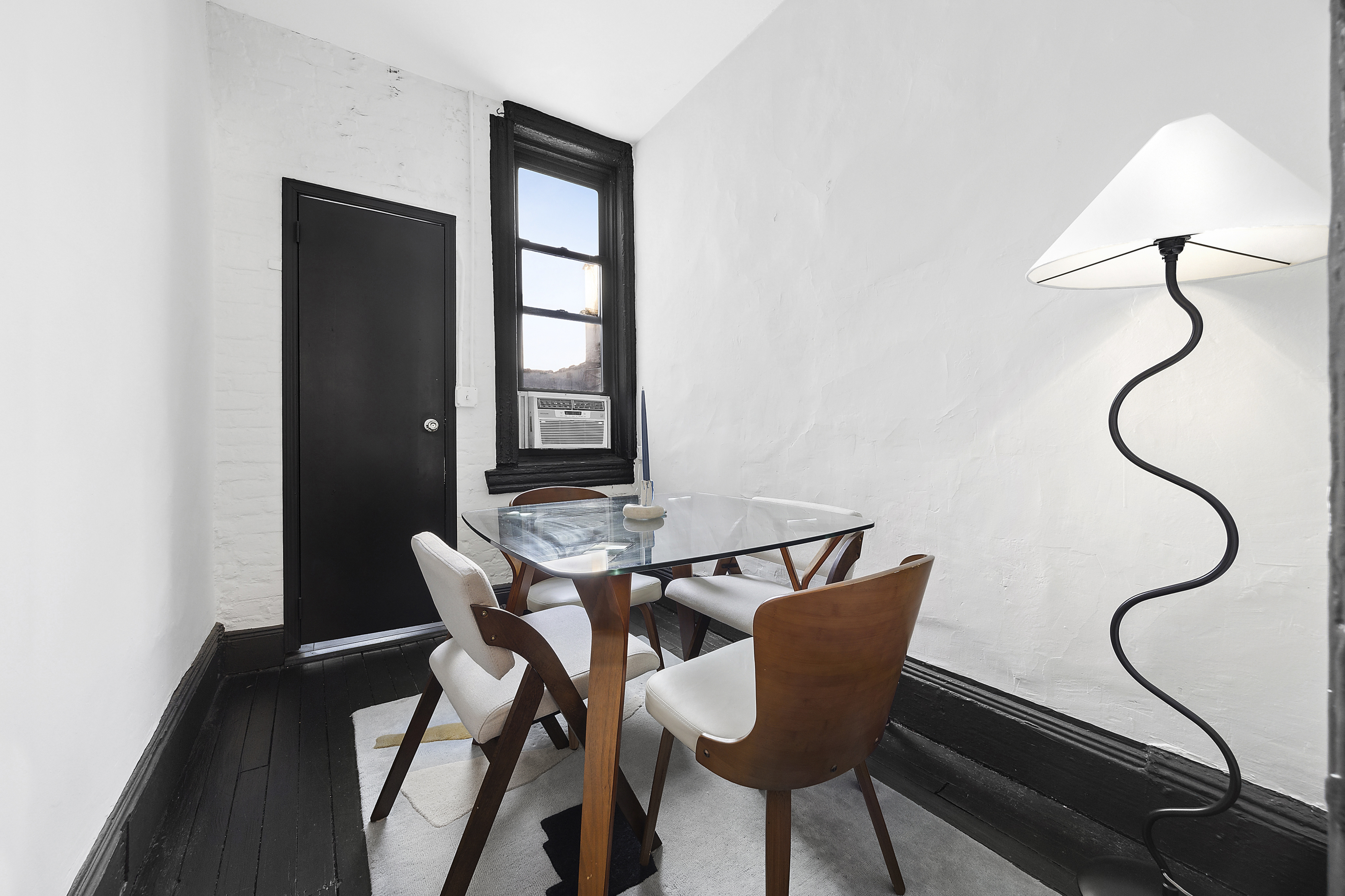 633 East 11th Street, Unit 23 Manhattan, NY 10009 - Photo 5 of 8 a dining room with furniture and window