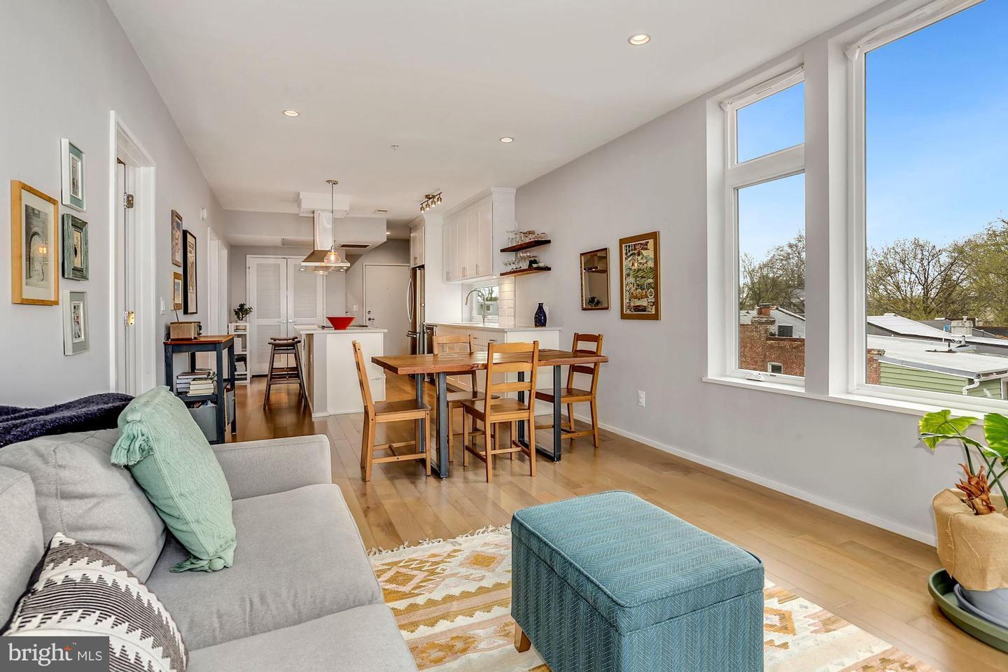 129 Varnum Street Northwest, Unit 6 Washington, DC 20011 - Photo 15 of 25 a living room with lots of furniture and a window