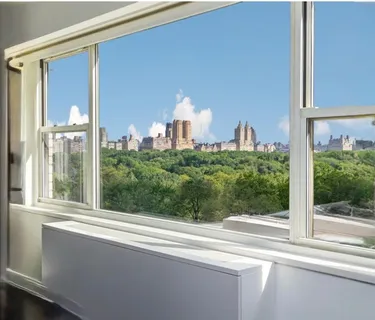 a view of a glass door with a balcony from a window
