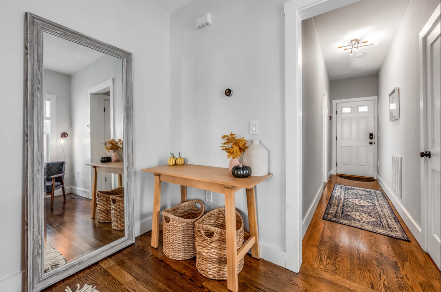 a dining room with furniture and wooden floor