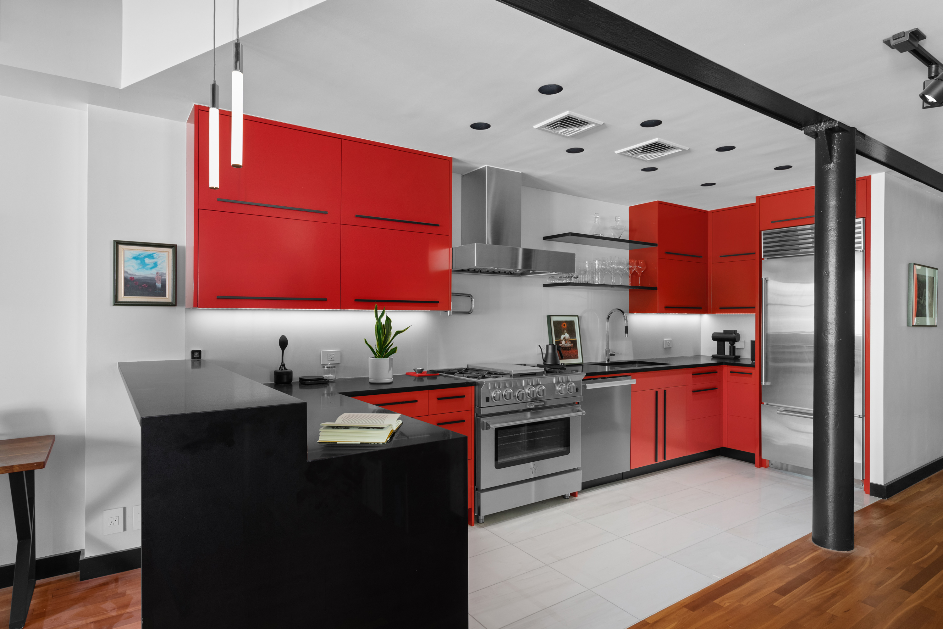 39 North Moore Street, Unit 2A Manhattan, NY 10013 - Photo 5 of 17 a kitchen with stainless steel appliances granite countertop a sink stove and refrigerator