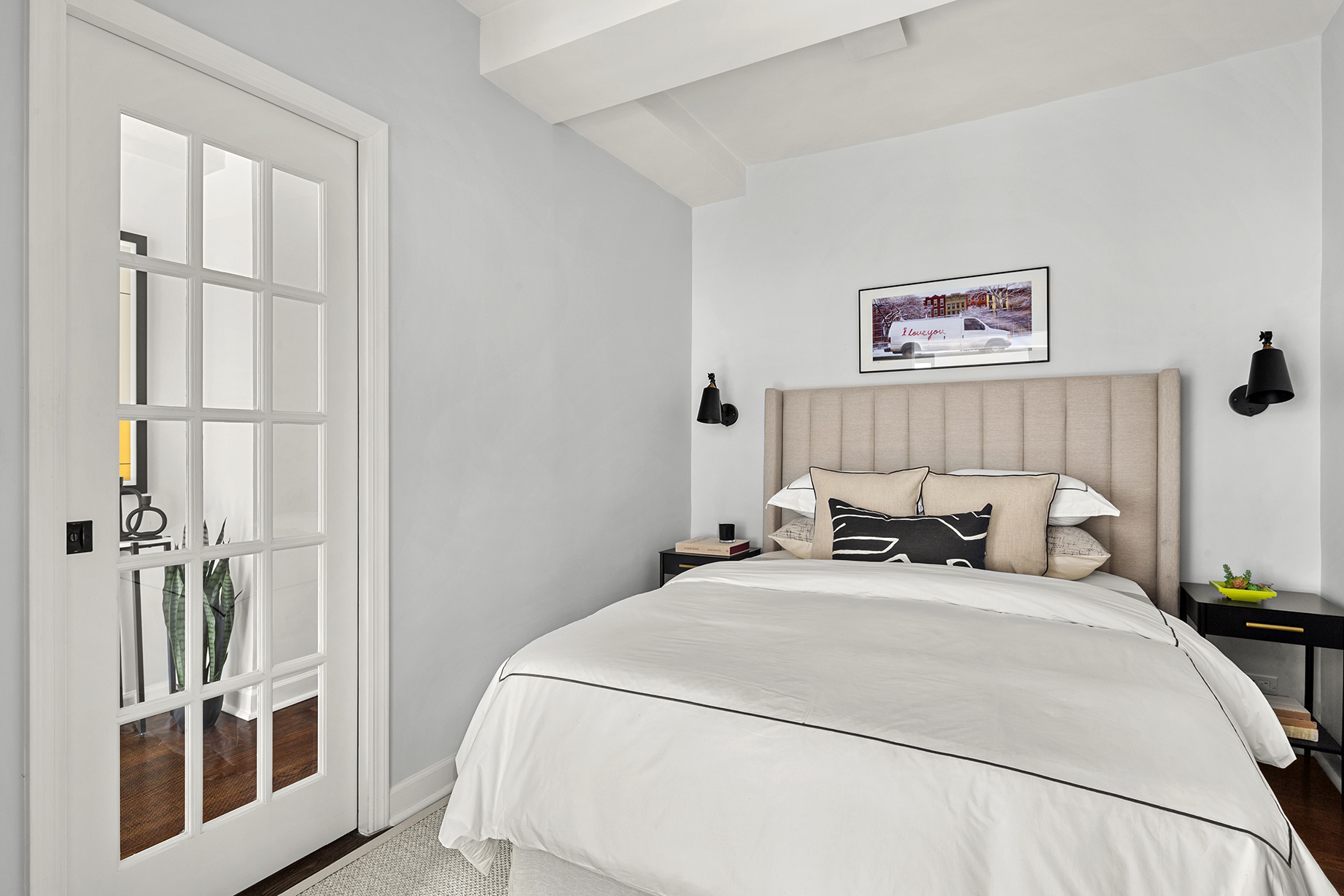 161 West 16th Street, Unit 6E Manhattan, NY 10011 - Photo 8 of 15 a bedroom with a bed and a window