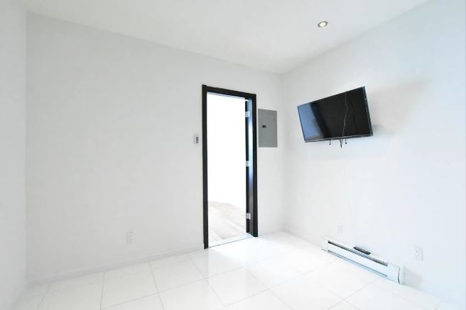 943 Columbus Avenue, Unit 2C Manhattan, NY 10025 - Photo 2 of 5 a view of a livingroom with a flat screen tv