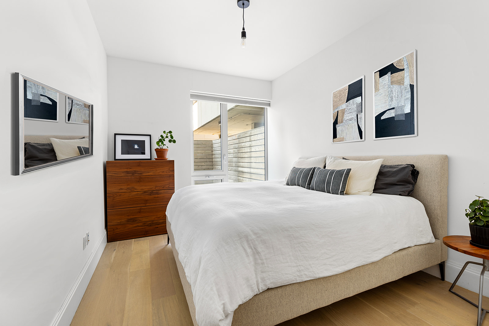 610 Warren Street, Unit GDNB Brooklyn, NY 11217 - Photo 8 of 17 a bedroom with a large bed a flat tv screen and dresser