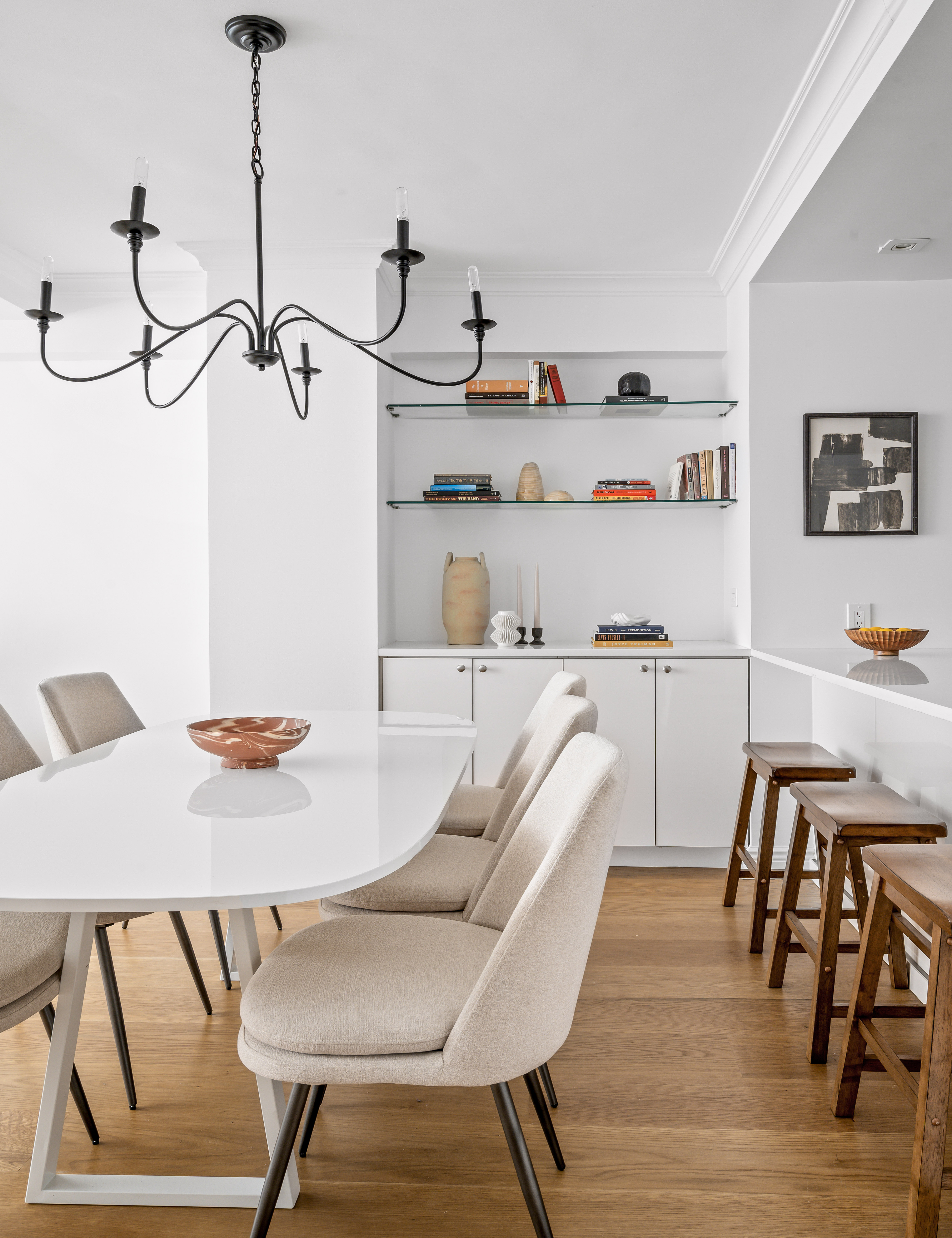 166 East 63rd Street, Unit 2J Manhattan, NY 10065 - Photo 5 of 14 a view of a dining room with furniture and wooden floor