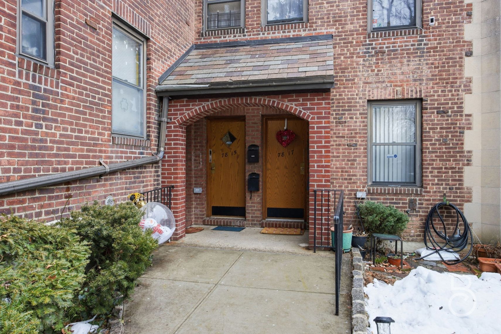 78-15 19th Drive, Unit B2 Queens, NY 11370 - Photo 16 of 17 a front view of a house with patio