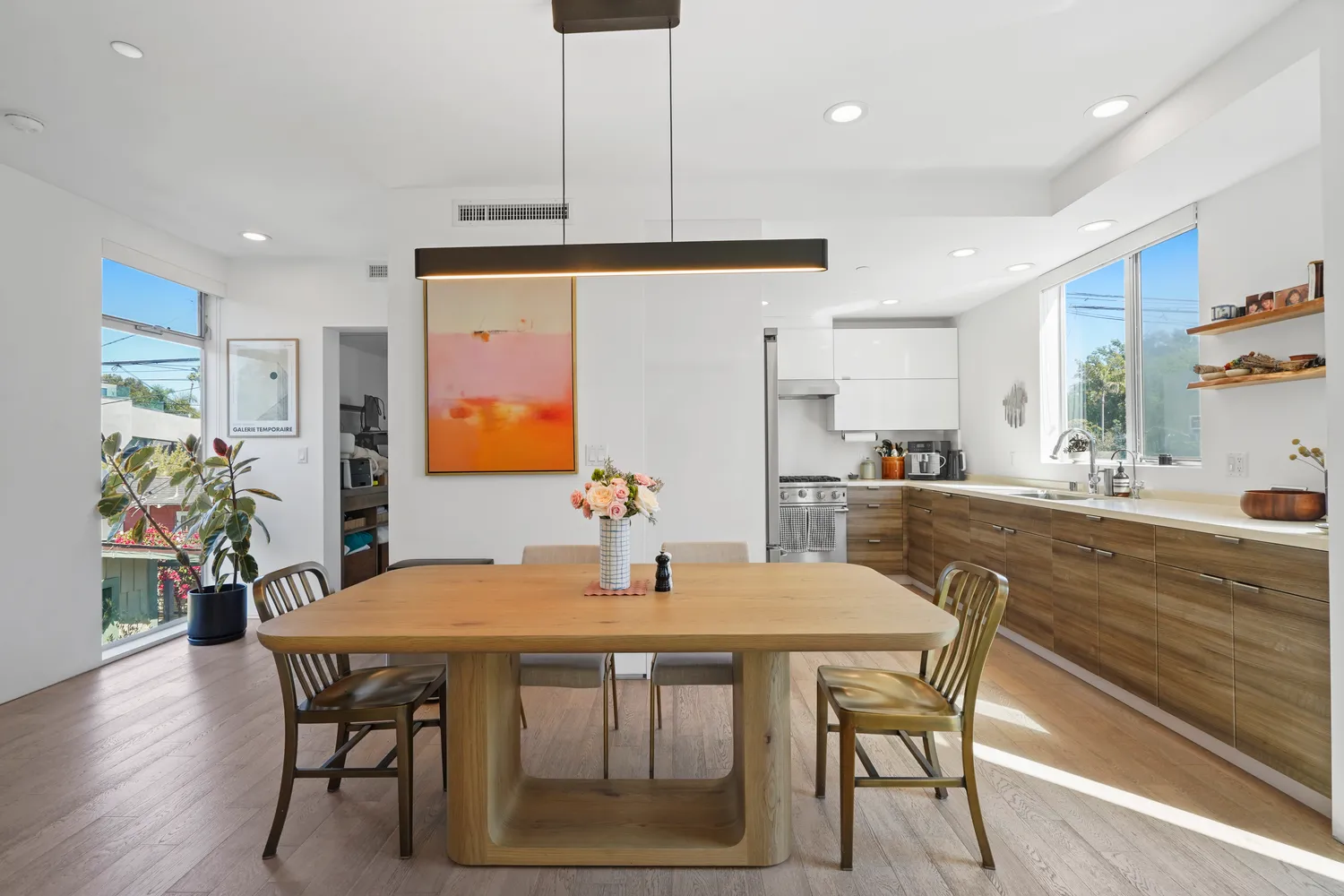 a dining room with furniture and wooden floor