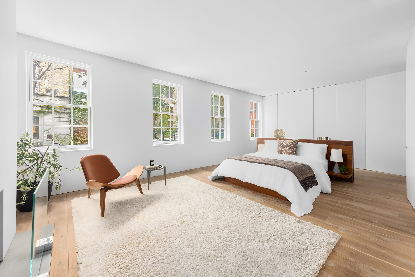 130 Charles Street Manhattan, NY 10014 - Photo 7 of 14 a bedroom with furniture and a window