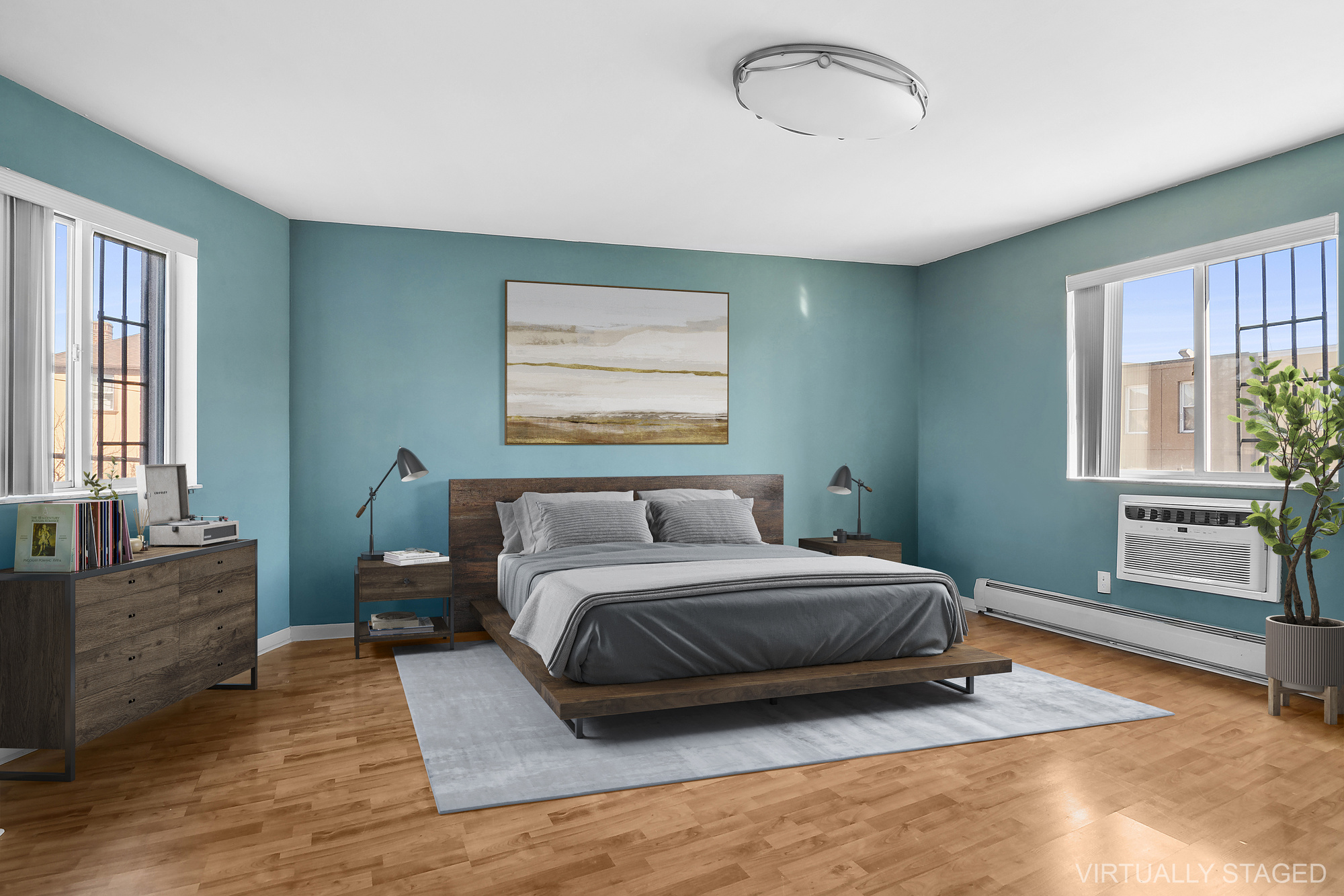 21-08 Butler Avenue, Unit J2 Queens, NY 11385 - Photo 2 of 14 a bedroom with a bed and window