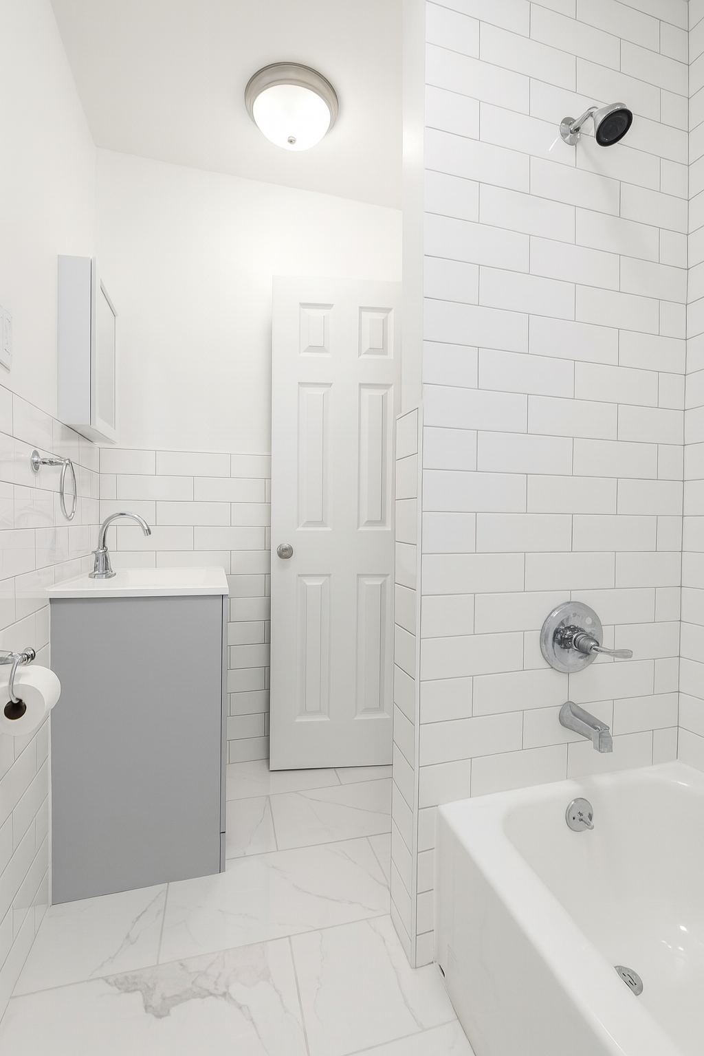 1001 Hart Street, Unit 2 Brooklyn, NY 11237 - Photo 7 of 24 a bathroom with a tub a sink and mirror