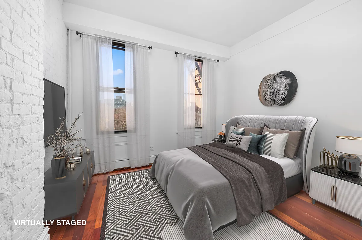 112 East 4th Street, Unit 6 Manhattan, NY 10003 - Photo 4 of 5 a bedroom with bed and a window