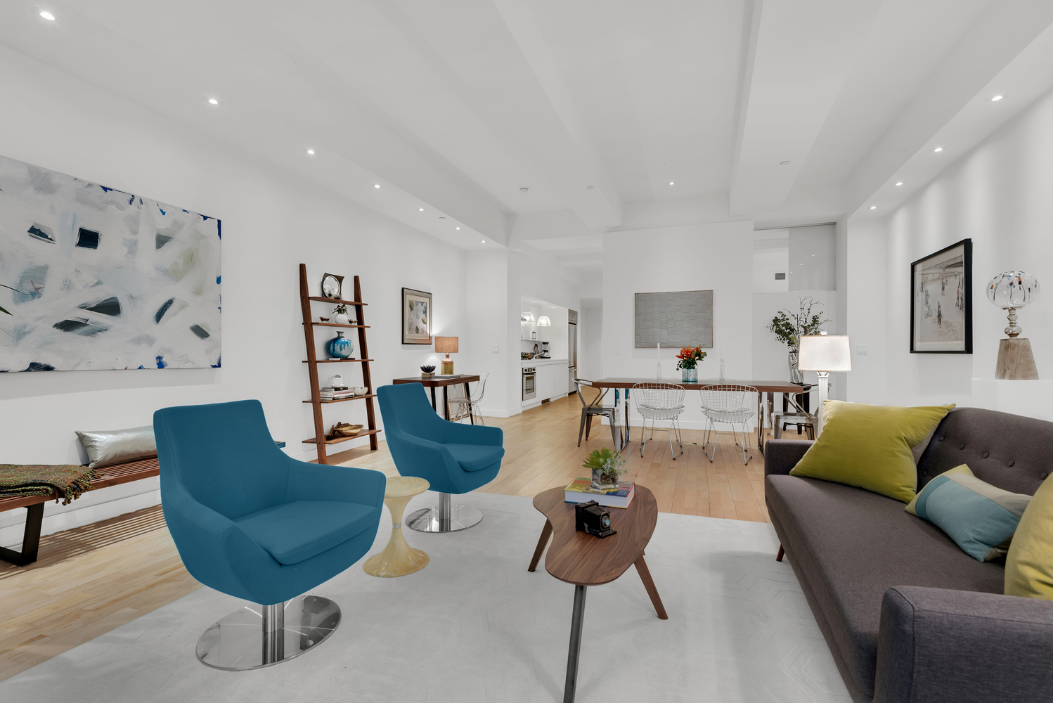 15 Broad Street, Unit 1230 Manhattan, NY 10005 - Photo 3 of 23 a living room with furniture a rug and a painting