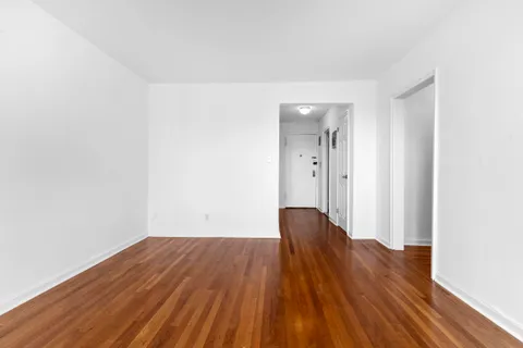 a view of wooden floor and brick walls
