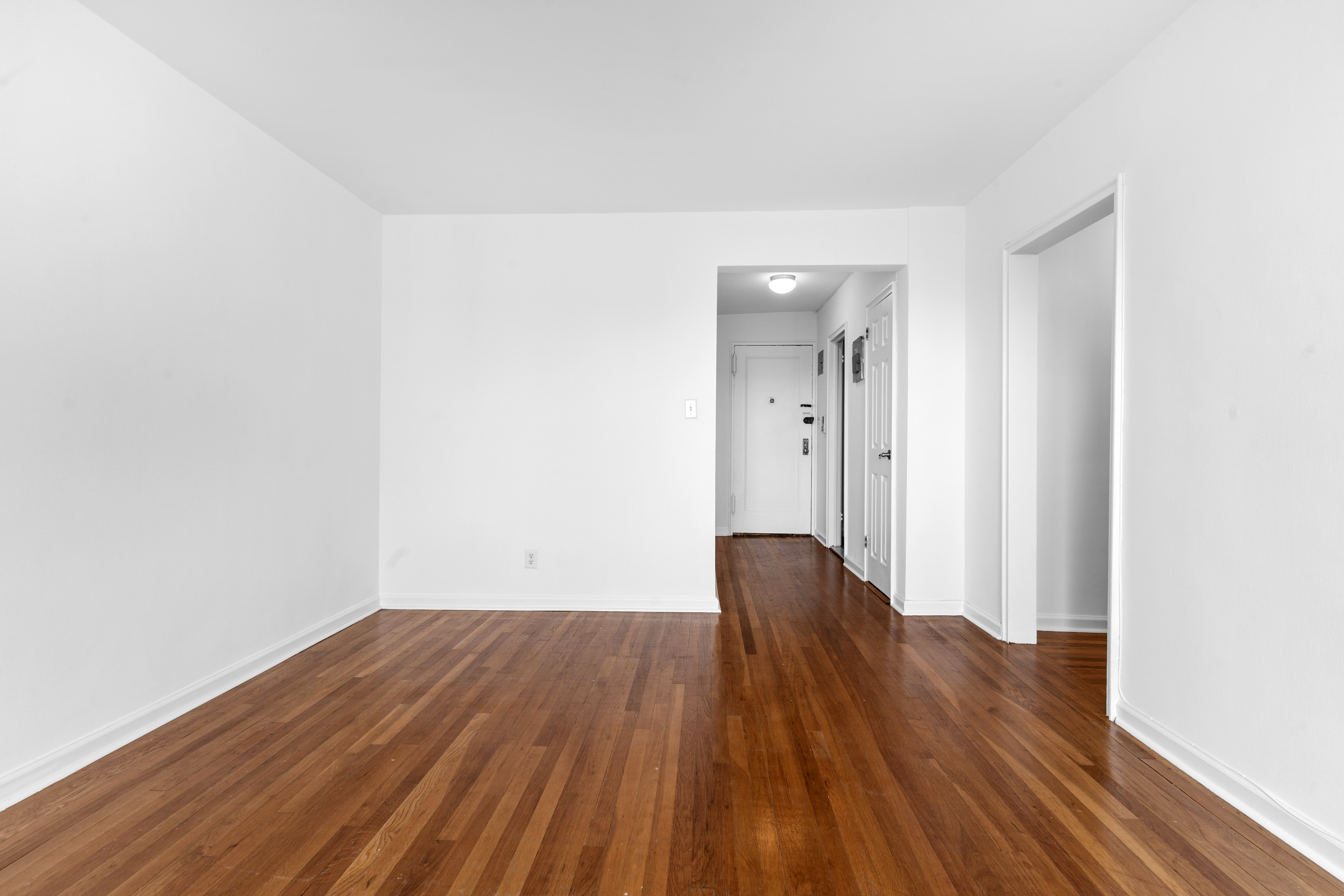 145 72nd Street, Unit F7 Brooklyn, NY 11209 - Photo 4 of 9 a view of wooden floor and brick walls