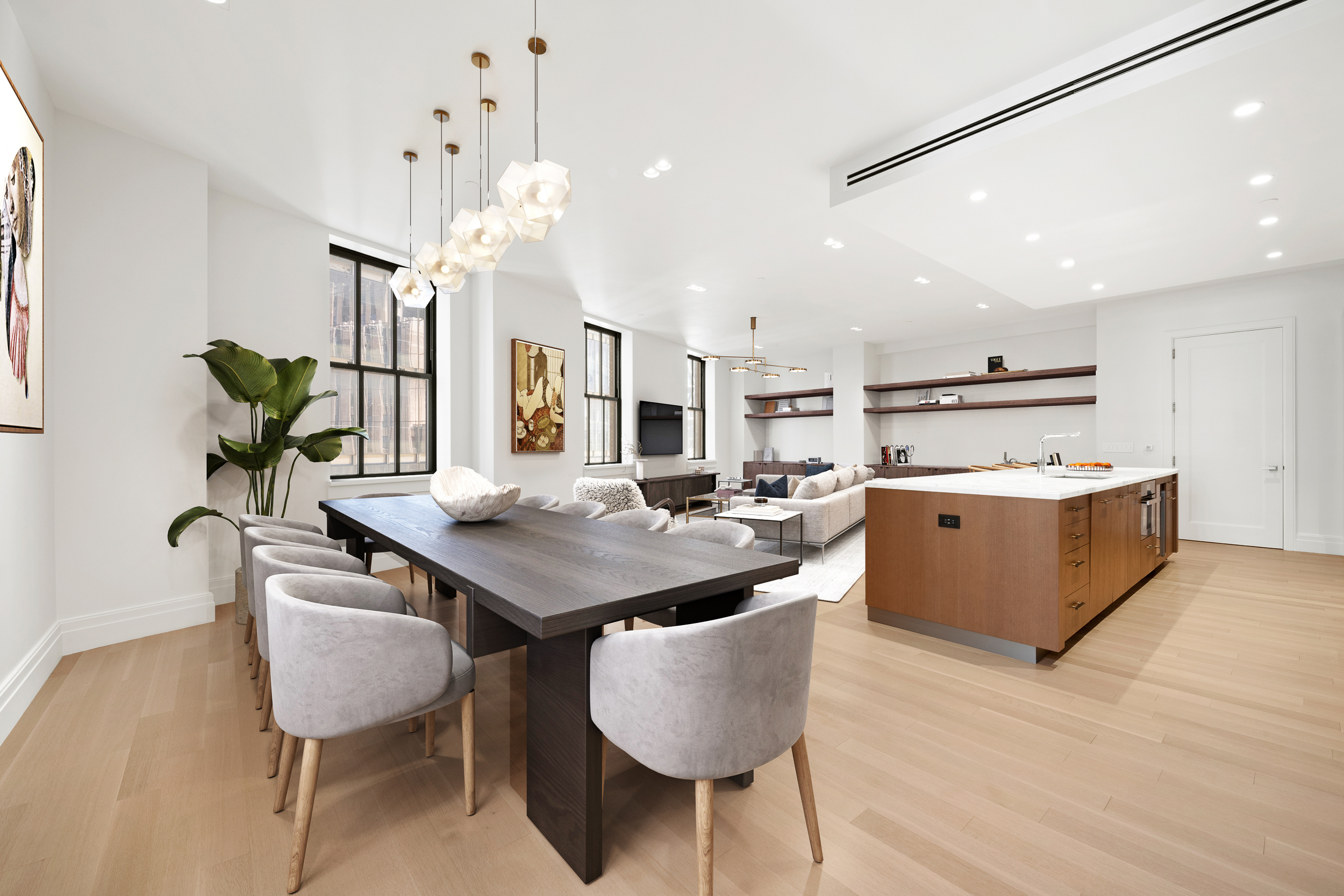 100 Barclay Street, Unit 13K Manhattan, NY 10007 - Photo 5 of 27 a living room with stainless steel appliances kitchen island a table chairs and a refrigerator
