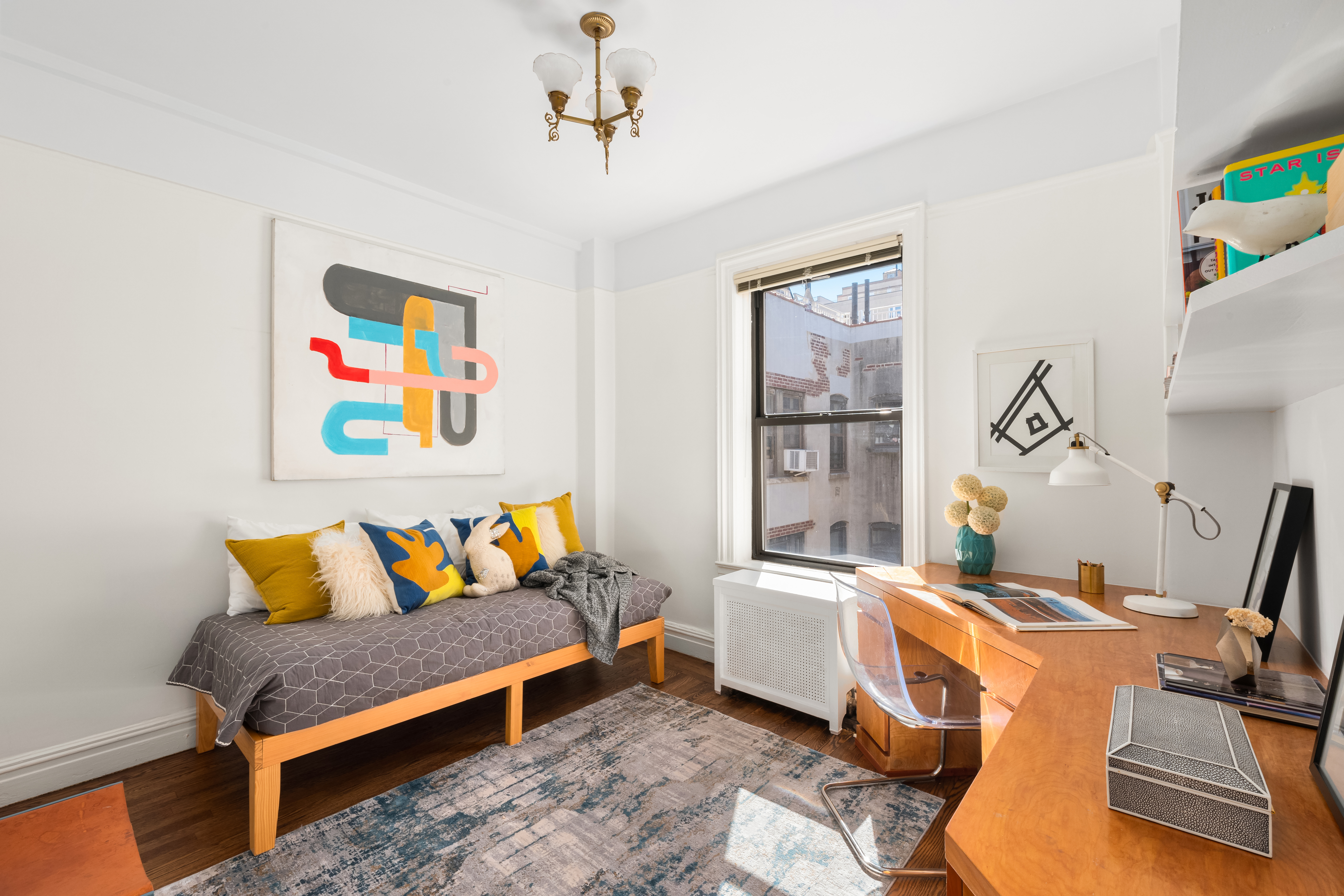 41 West 82nd Street, Unit 9D Manhattan, NY 10024 - Photo 11 of 15 a living room with a couch and a table