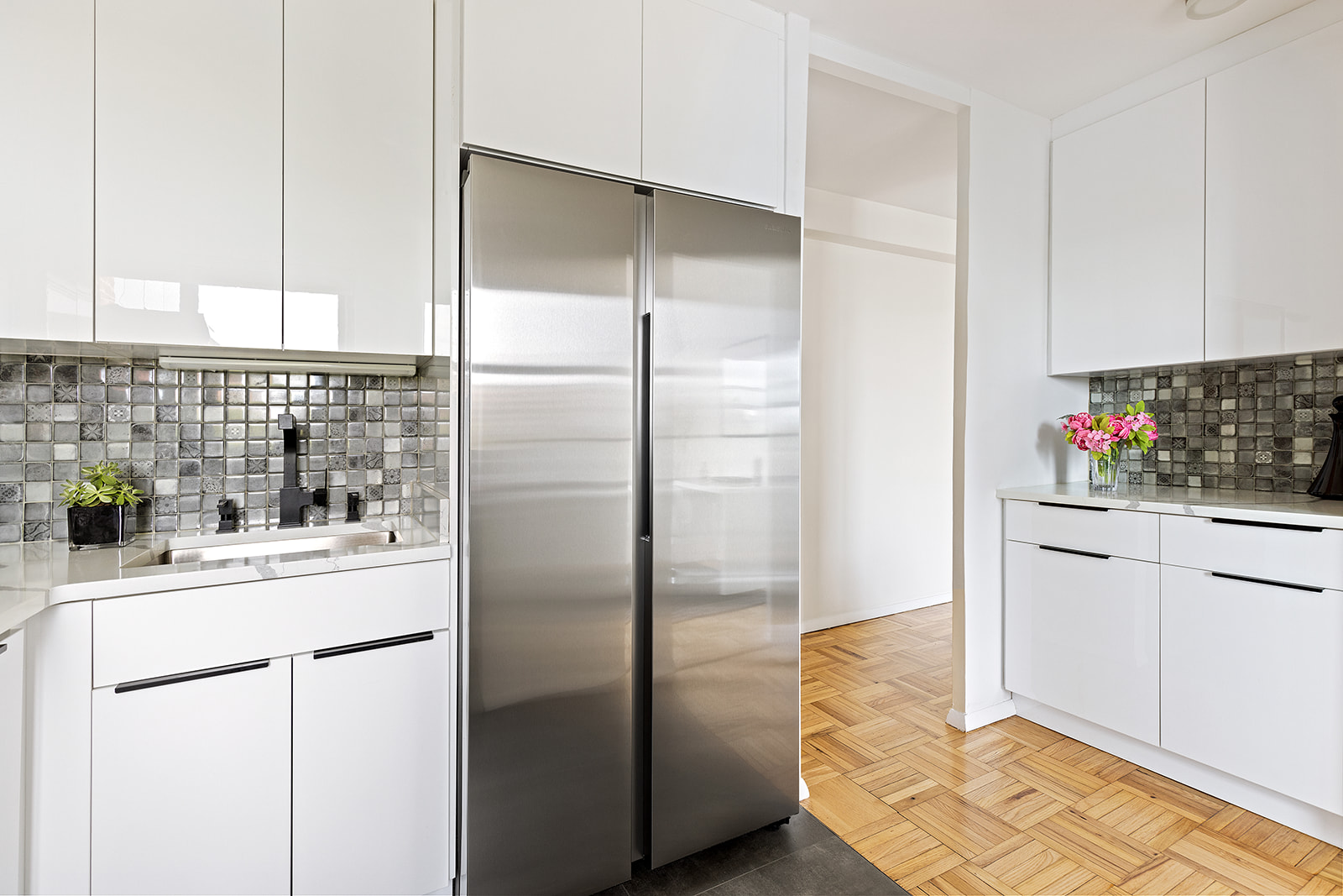 193 Clinton Avenue, Unit 9E Brooklyn, NY 11205 - Photo 5 of 9 a kitchen with stainless steel appliances a refrigerator and cabinets