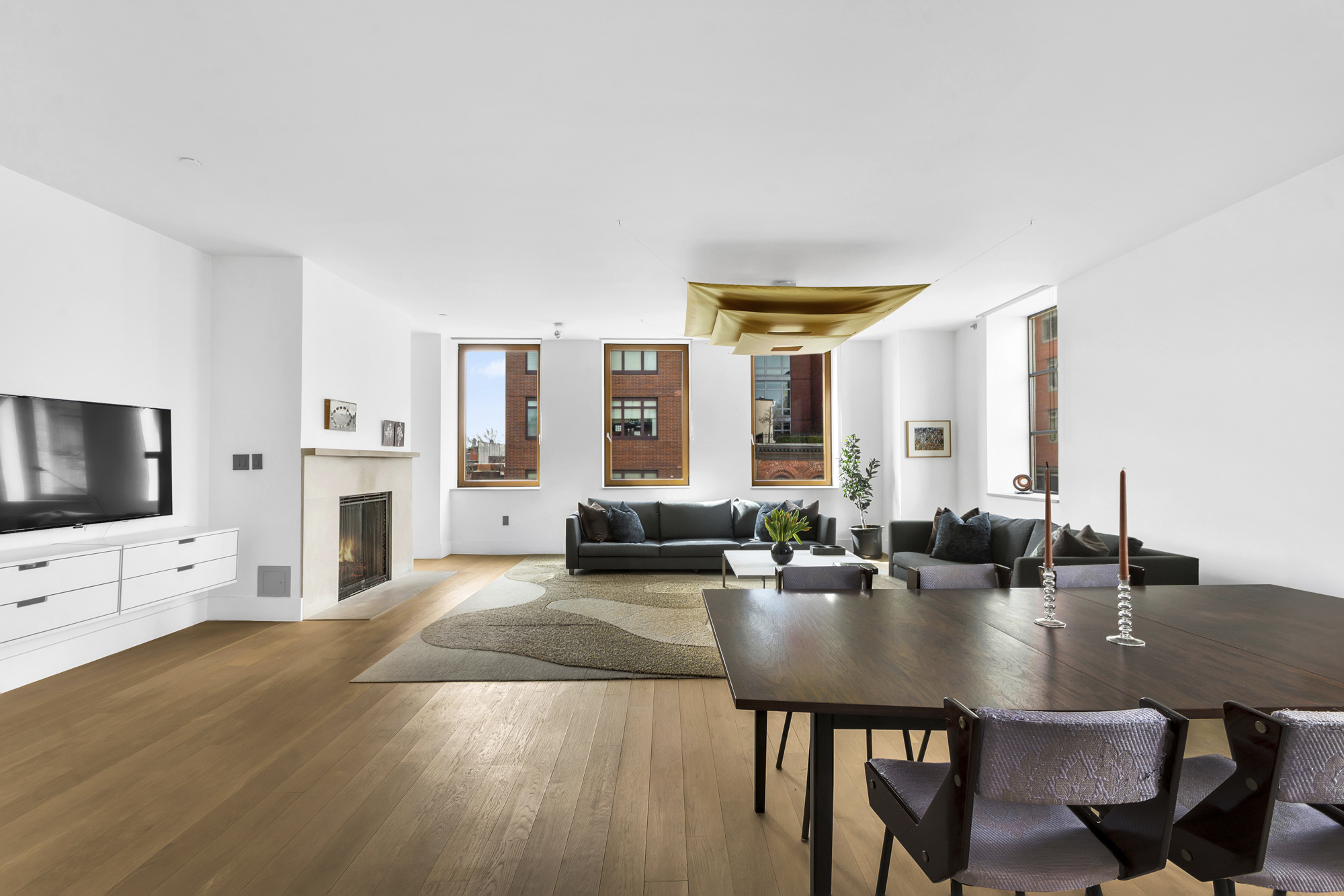 267 West 124th Street, Unit 6A Manhattan, NY 10027 - Photo 6 of 24 a view of a livingroom with furniture and a flat screen tv