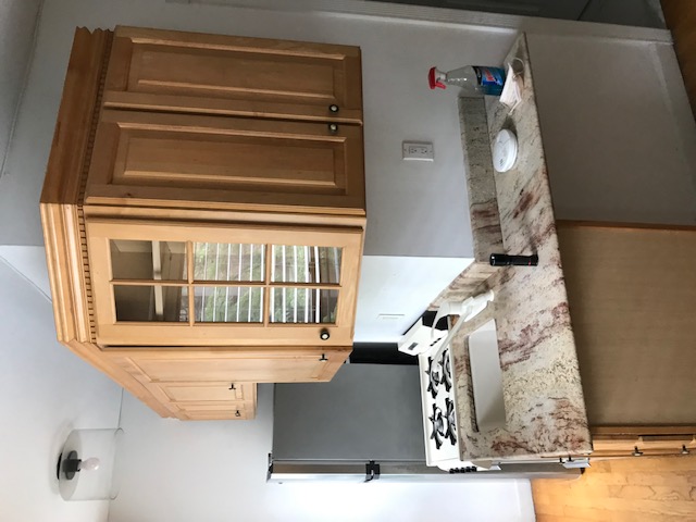 127 East 31st Street, Unit 2A Manhattan, NY 10016 - Photo 3 of 5 a kitchen with stainless steel appliances granite countertop a sink stove and refrigerator