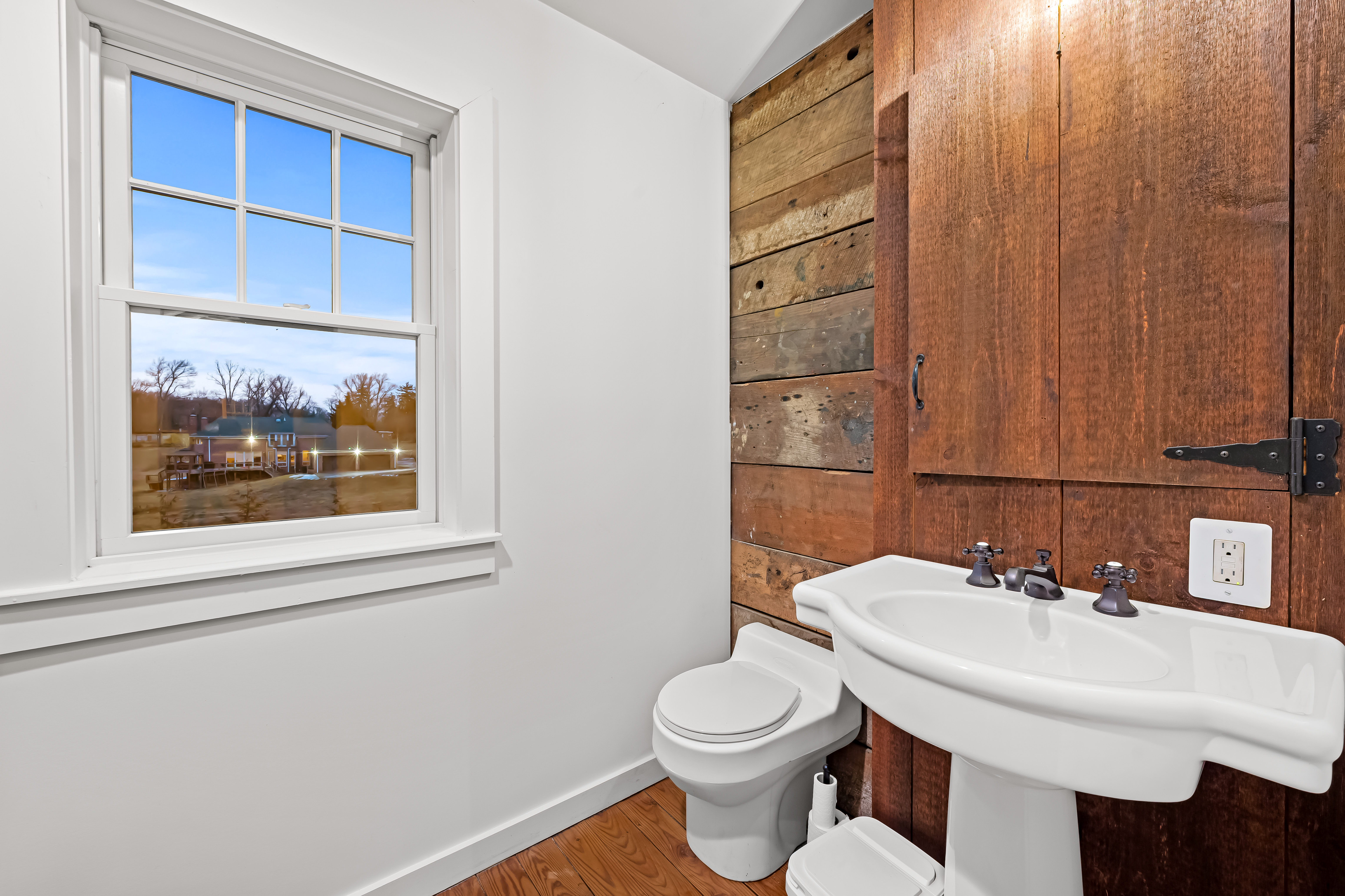 8412 Stevenson Road Pikesville, MD 21208 - Photo 19 of 81 a bathroom with a toilet a sink and a mirror