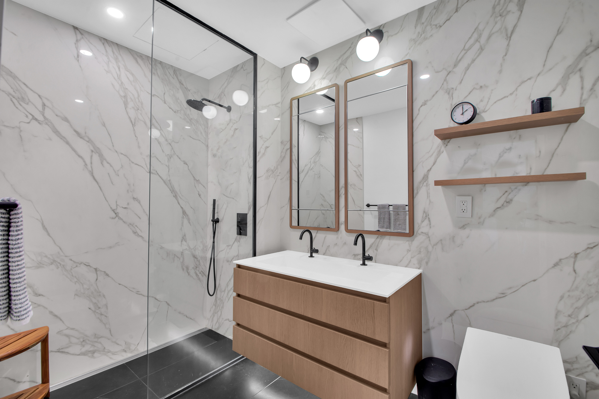 5 Court Square West, Unit 8A Queens, NY 11101 - Photo 5 of 7 a bathroom with a sink a toilet and shower