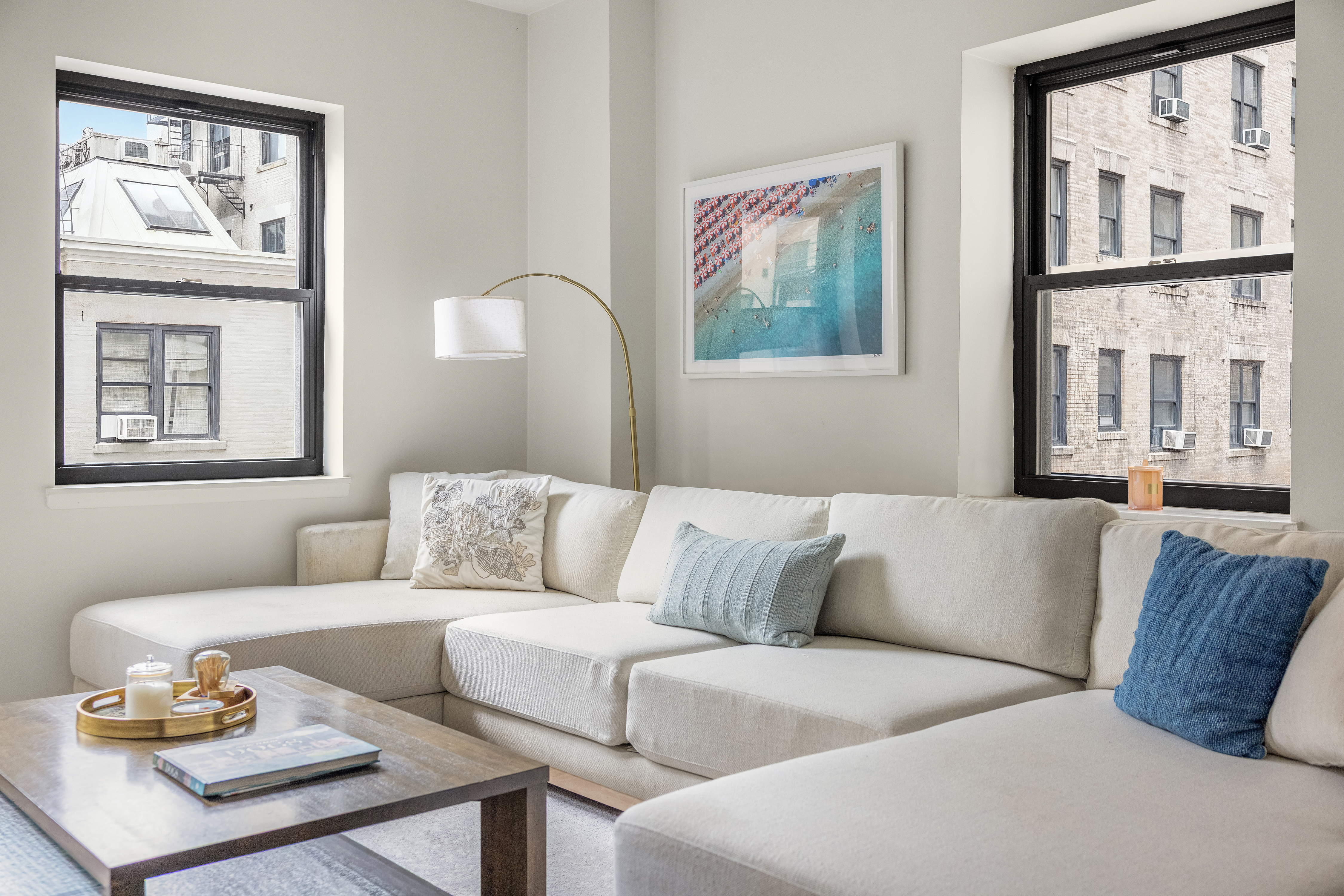253 West 73rd Street, Unit 4N Manhattan, NY 10023 - Photo 2 of 9 a living room with furniture and a large window