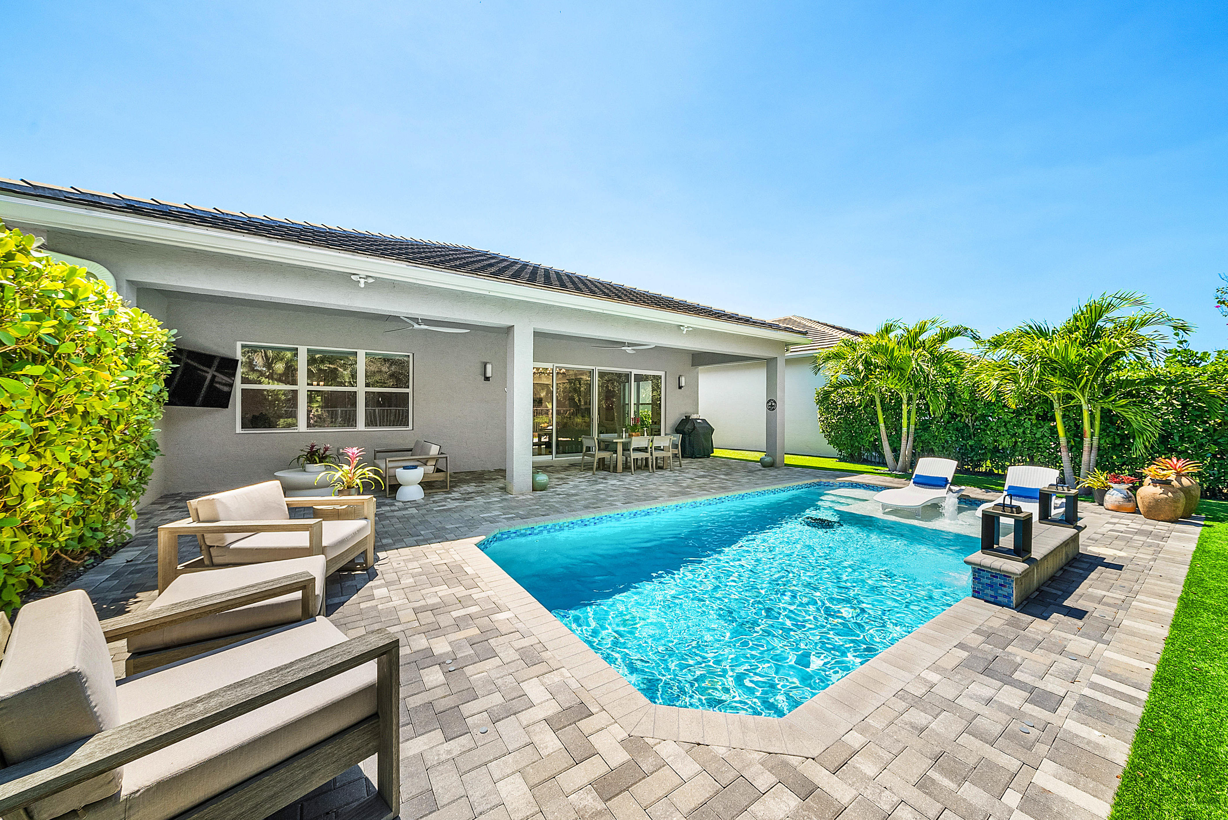 13172 Whistler Mountain Road Delray Beach, FL 33446 - Photo 3 of 38 a view of a house with backyard sitting area and garden