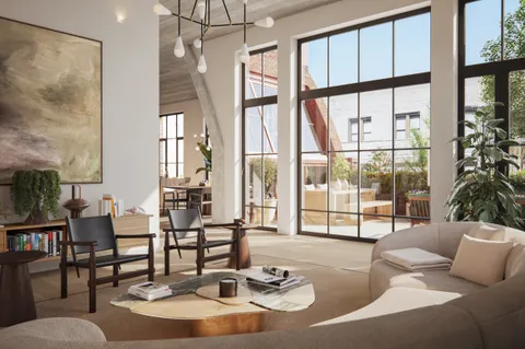 a living room with couches and a large window with outer view