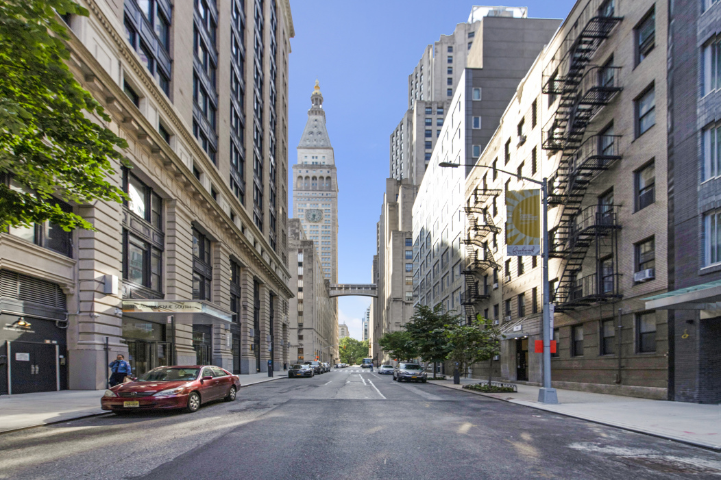 148 East 24th Street, Unit 6E Manhattan, NY 10010 - Photo 6 of 12 a city street lined with buildings and cars