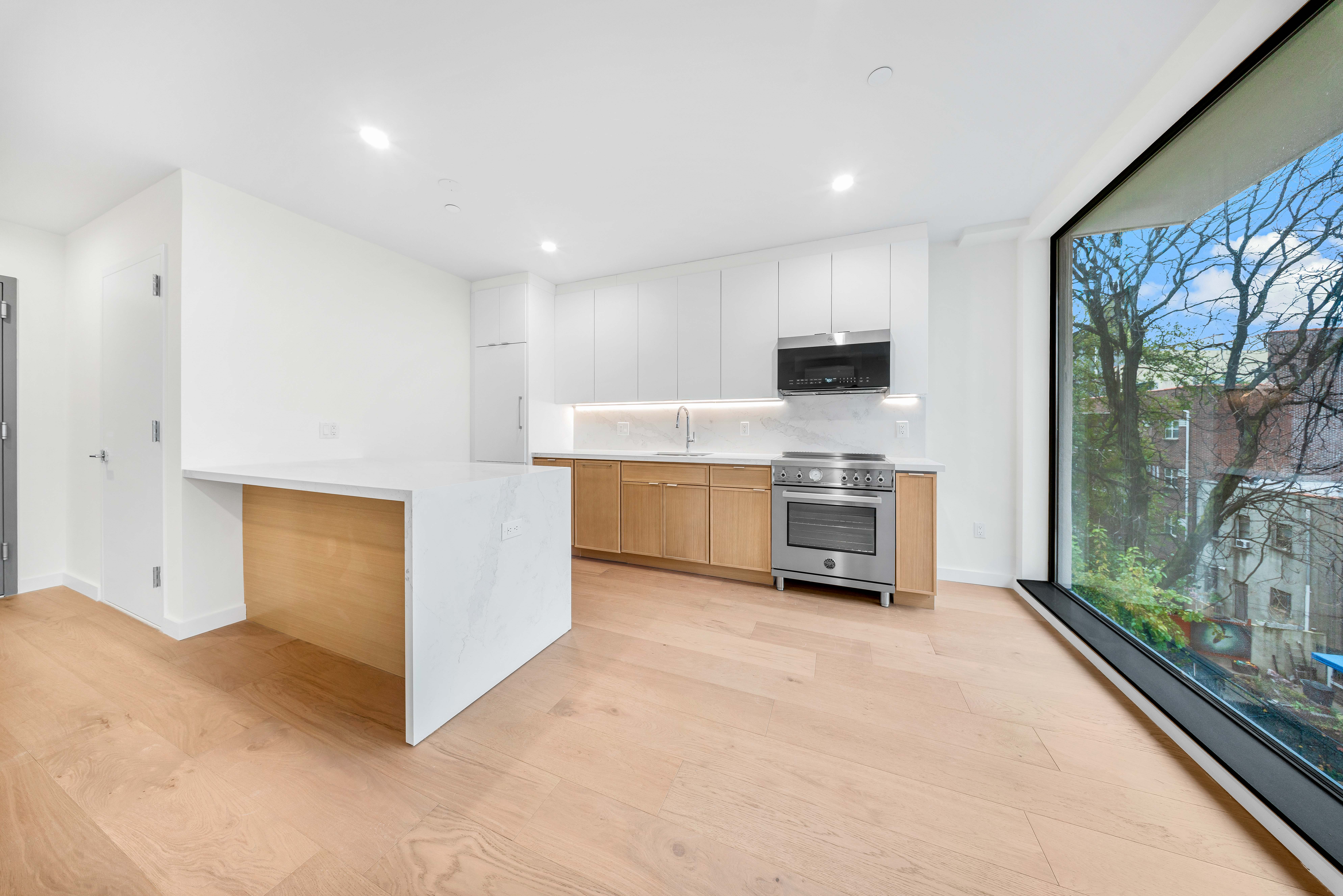 a kitchen with a refrigerator and a stove