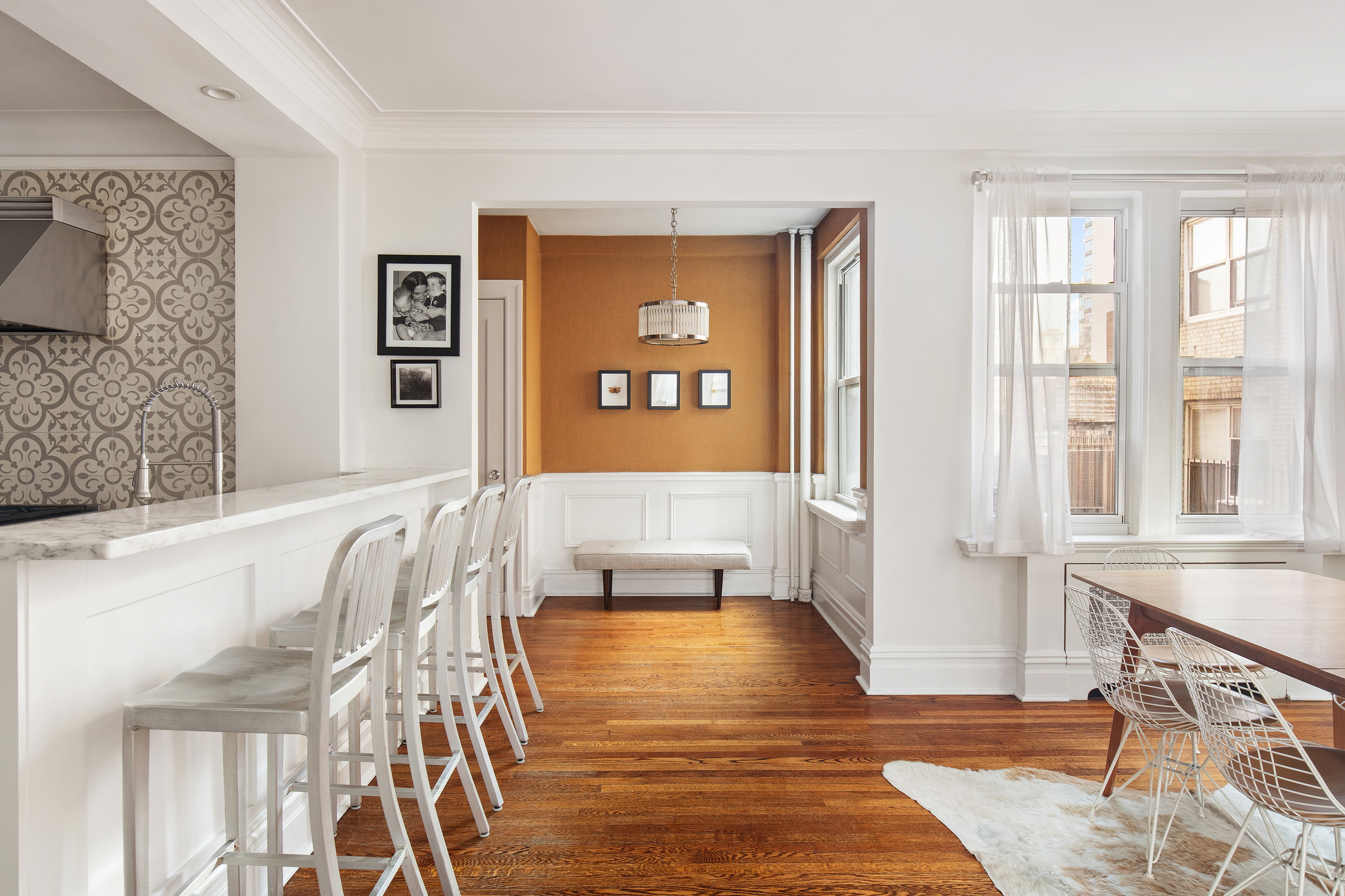 136 East 36th Street, Unit 9/10C Manhattan, NY 10016 - Photo 4 of 16 a living room with furniture and a window