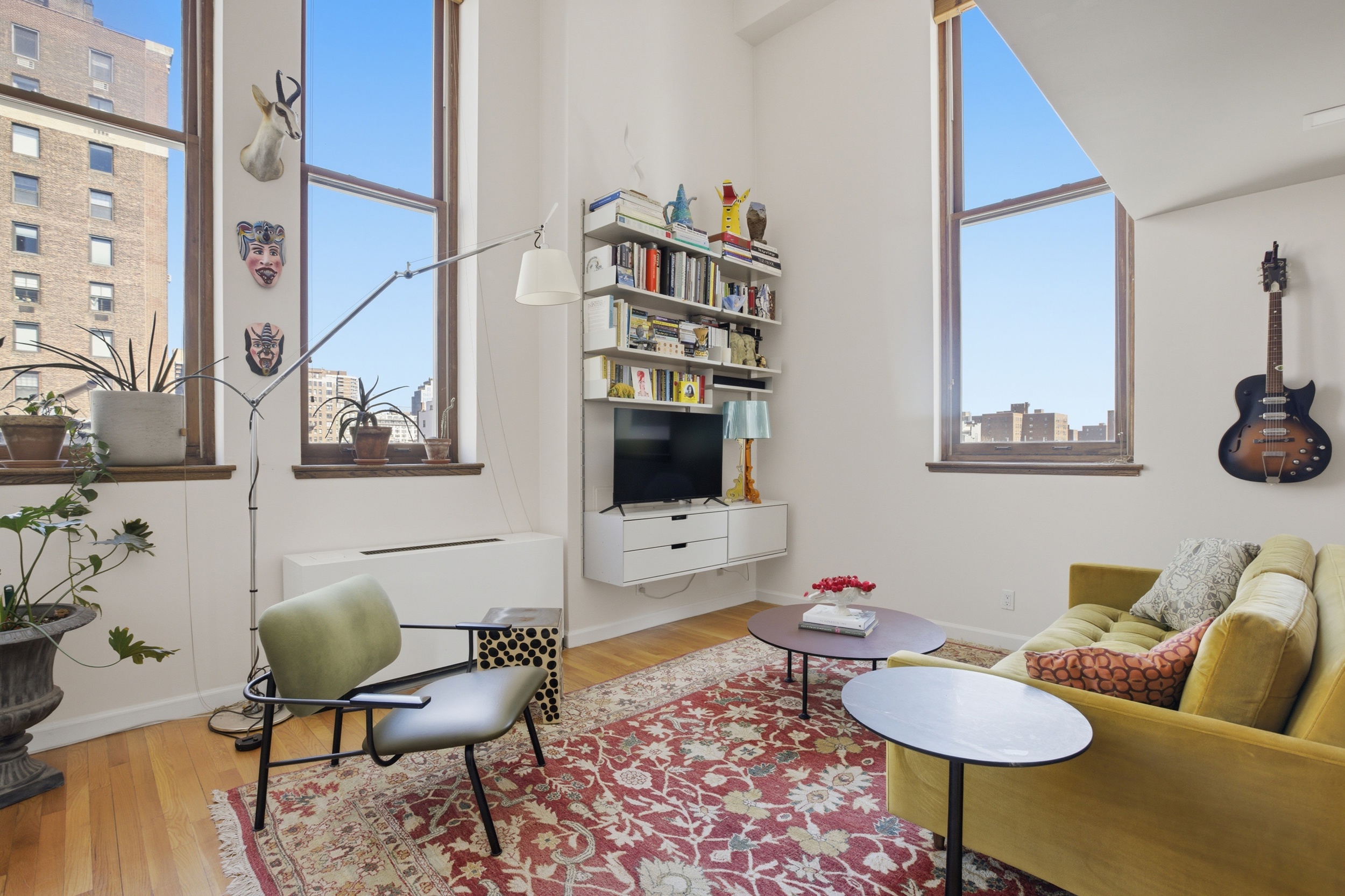 305 2nd Avenue, Unit 521 Manhattan, NY 10003 - Photo 1 of 20 a living room with furniture and wooden floor