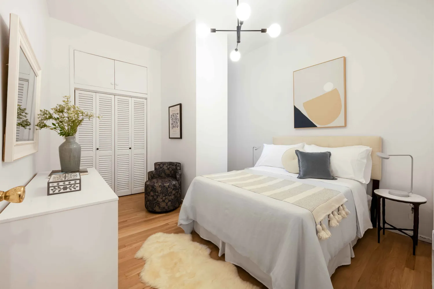 a bedroom with a bed and a table