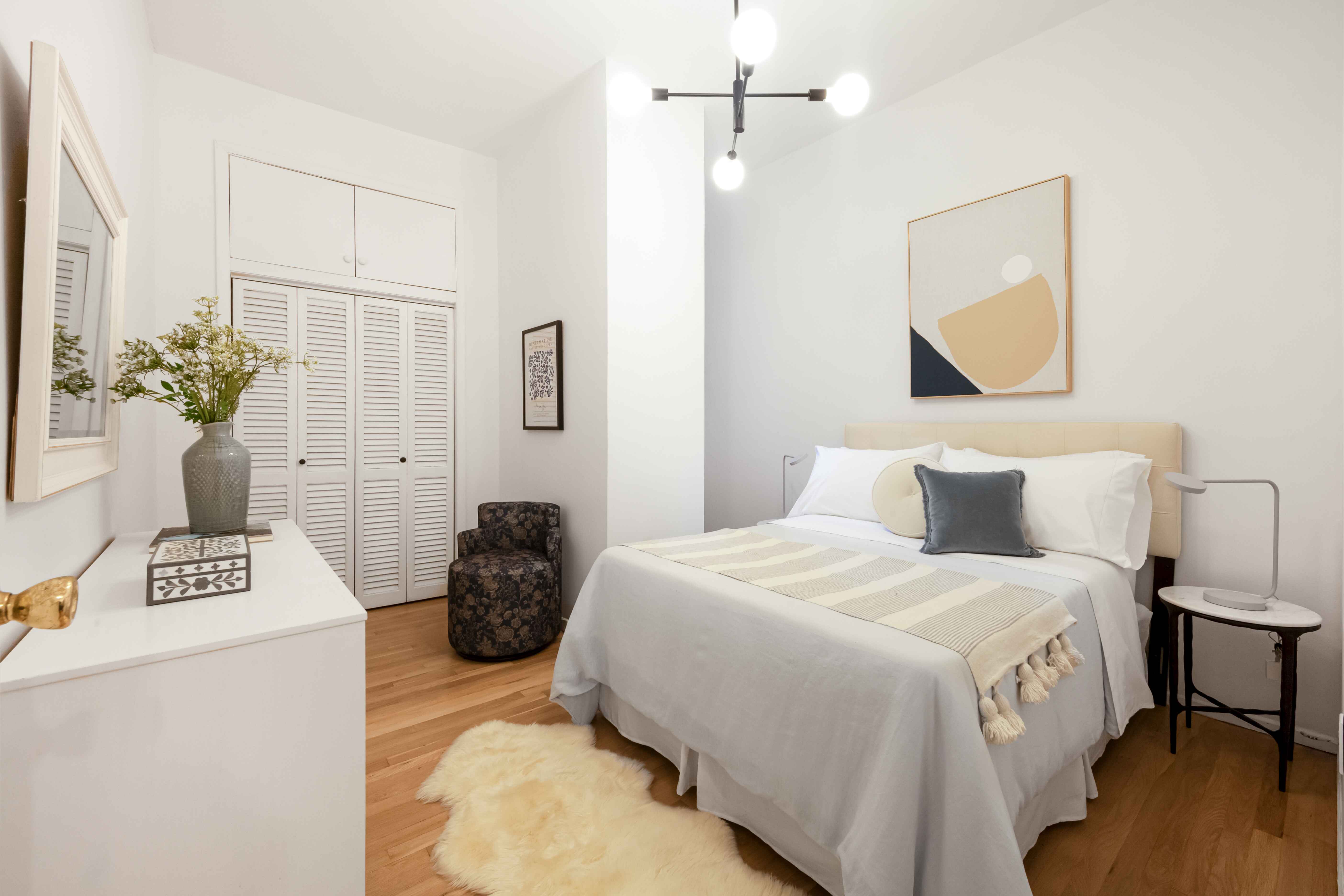 420 6th Avenue, Unit 11 Brooklyn, NY 11215 - Photo 5 of 10 a bedroom with a bed and a table