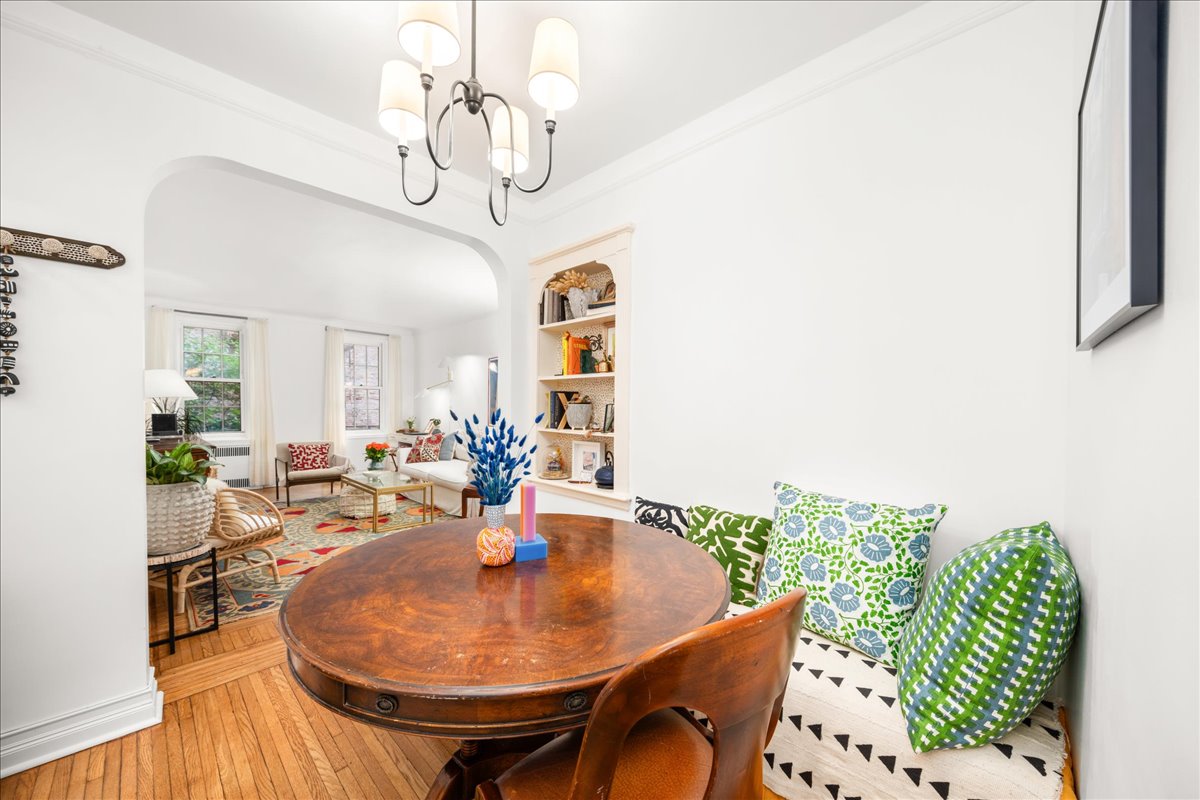 360 Clinton Avenue, Unit 1D Brooklyn, NY 11238 - Photo 4 of 17 a dining room with furniture and wooden floor