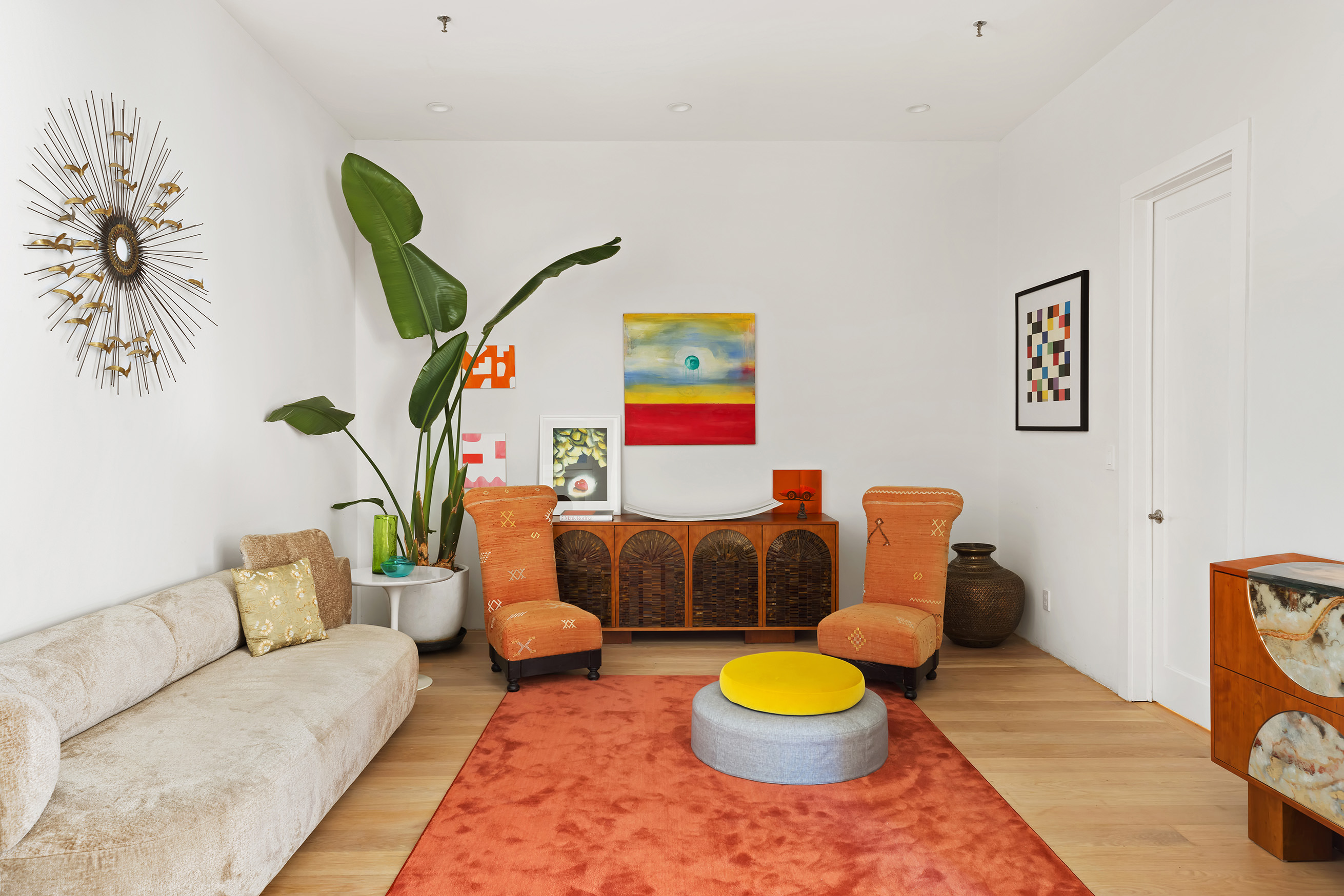 60 Warren Street, Unit 2 Manhattan, NY 10007 - Photo 7 of 16 a living room with furniture and a wooden floor