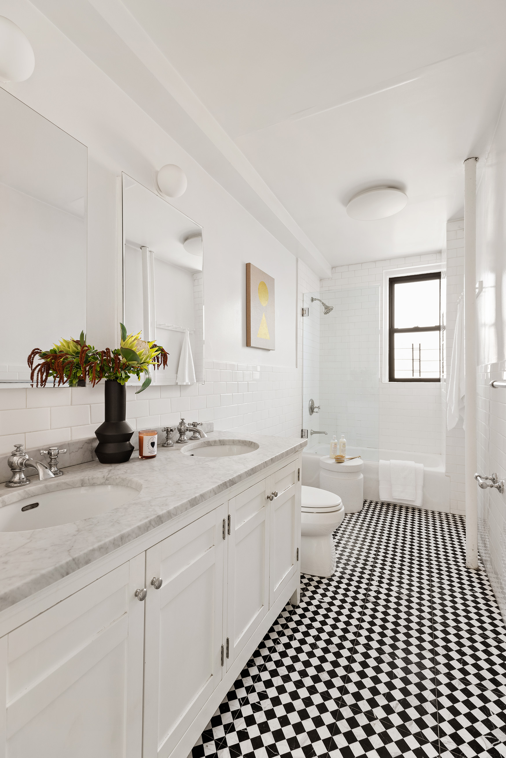 141 East 3rd Street, Unit 5H Manhattan, NY 10009 - Photo 7 of 12 a bathroom with a sink a toilet and mirror