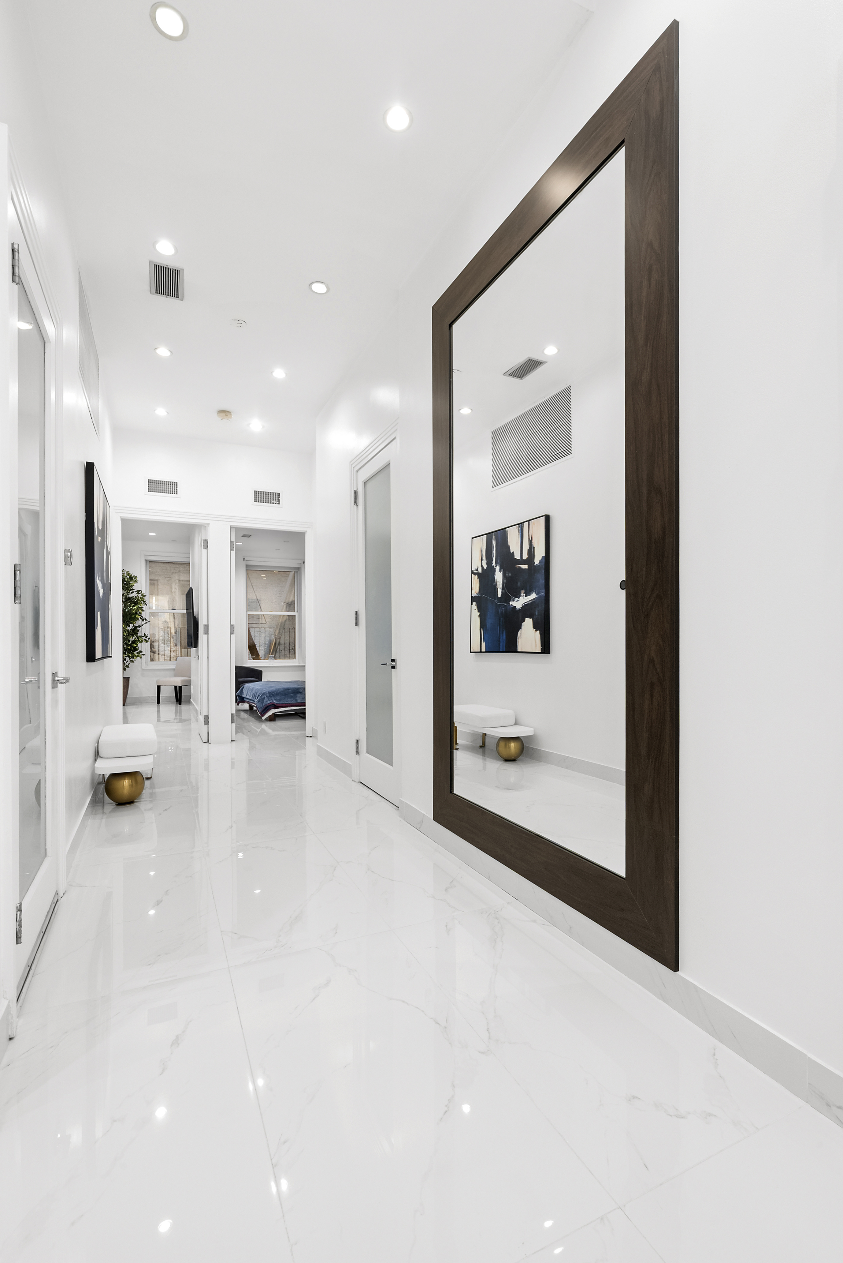 53 Murray Street, Unit 1 Manhattan, NY 10007 - Photo 6 of 12 a view of a hallway with dining area and chandelier