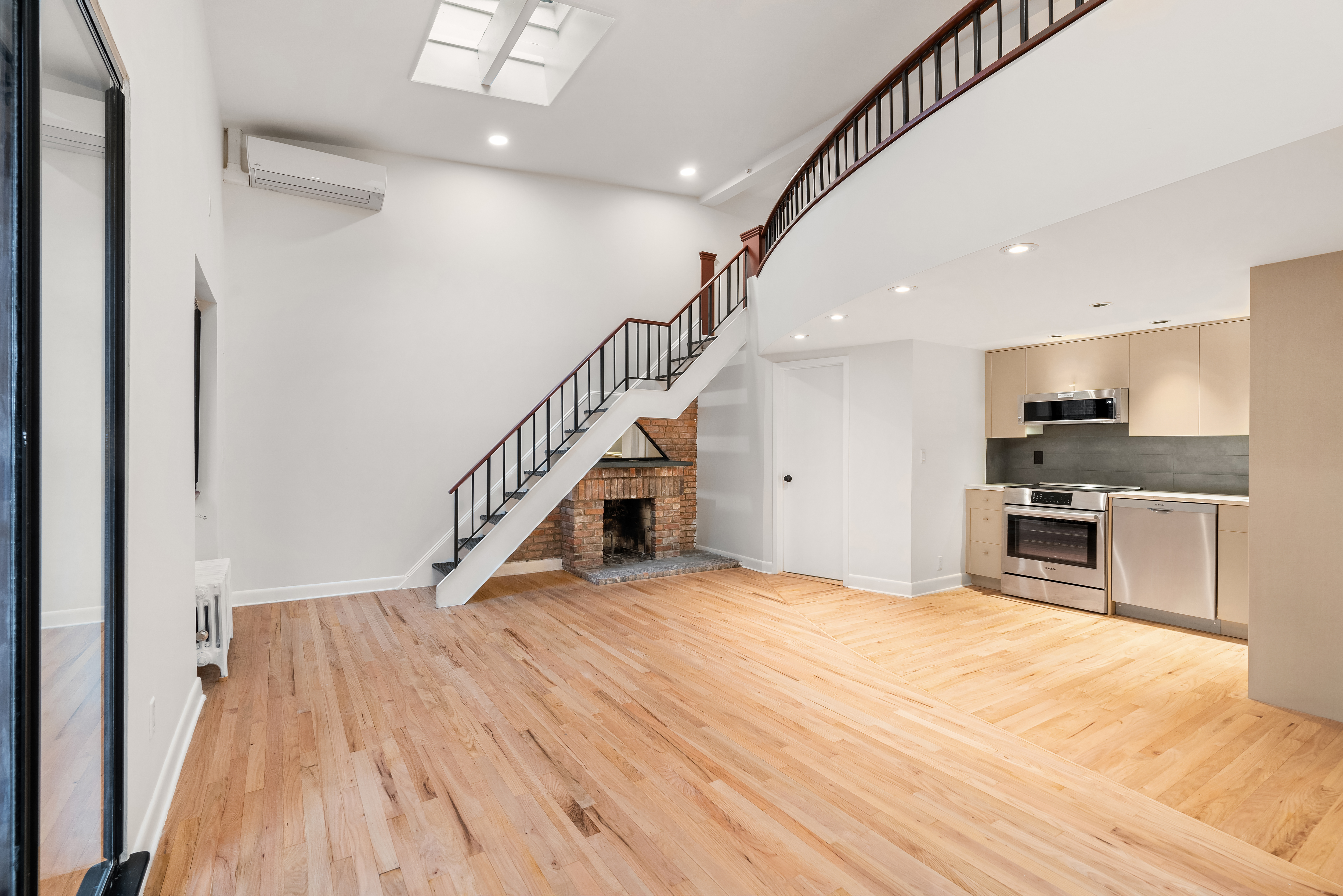 a view of kitchen with microwave and stove