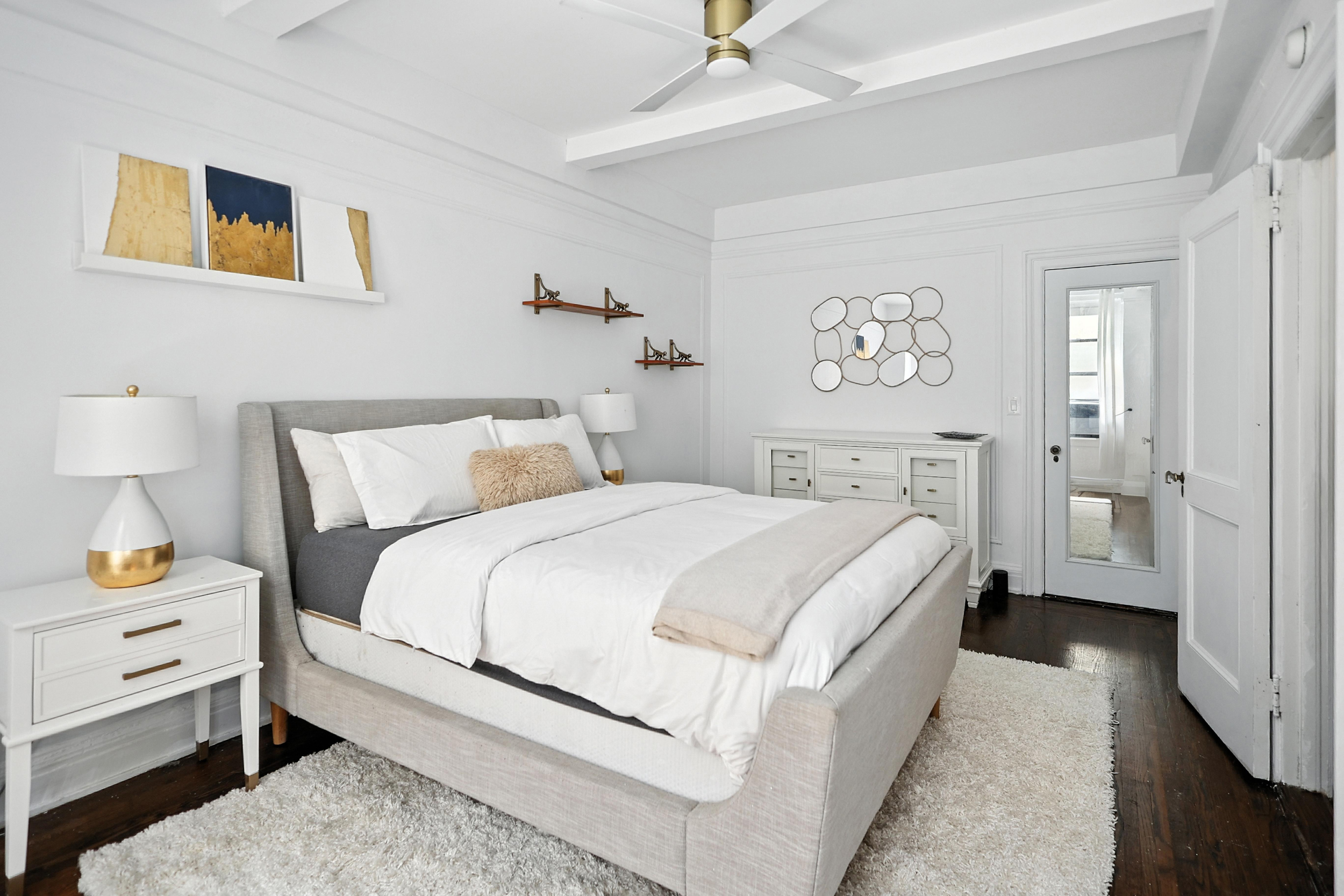 215 West 75th Street, Unit 6B Manhattan, NY 10023 - Photo 7 of 12 a bedroom with a bed and a night stand