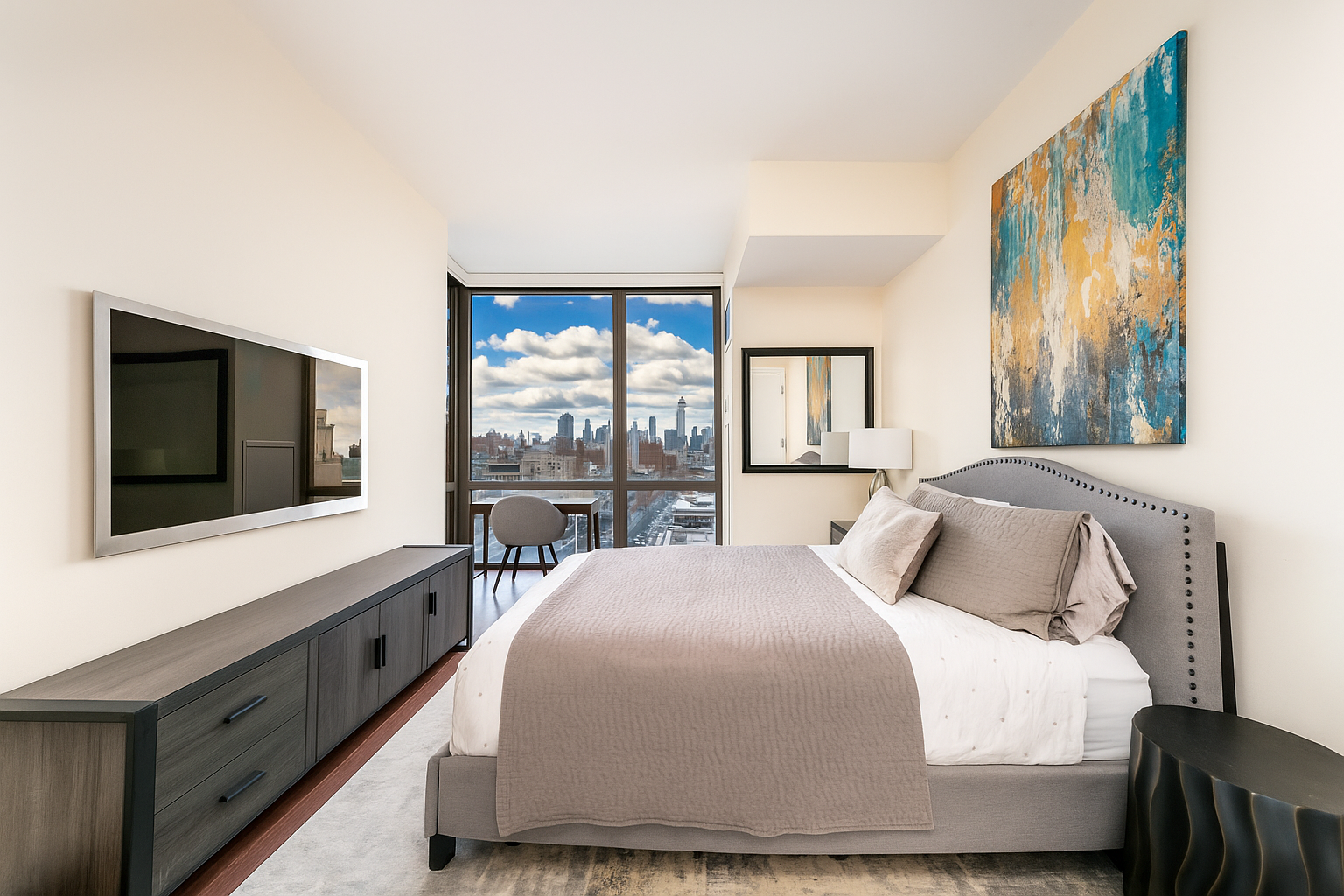 101 West 24th Street, Unit 16D Manhattan, NY 10011 - Photo 10 of 23 a bedroom with a large bed and a flat tv screen on dresser