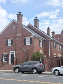 a view of a car parked in front of a building
