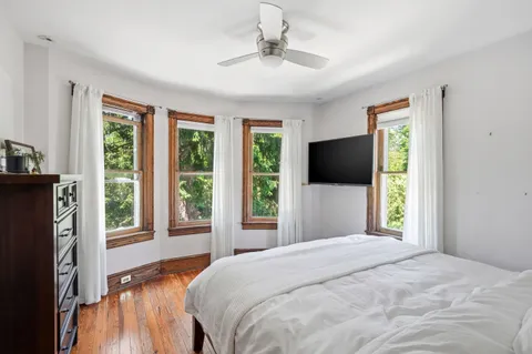 a bedroom with a bed and a window