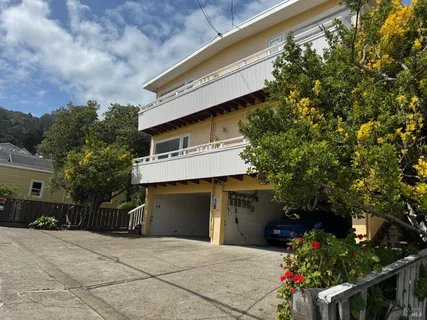 a front view of a house with a garage