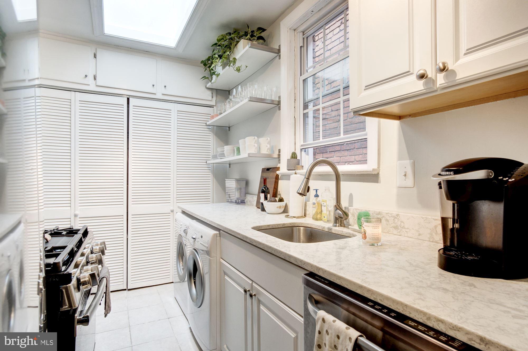 731 13th Street Northeast Washington, DC 20002 - Photo 19 of 43 a kitchen with a sink appliances and cabinets