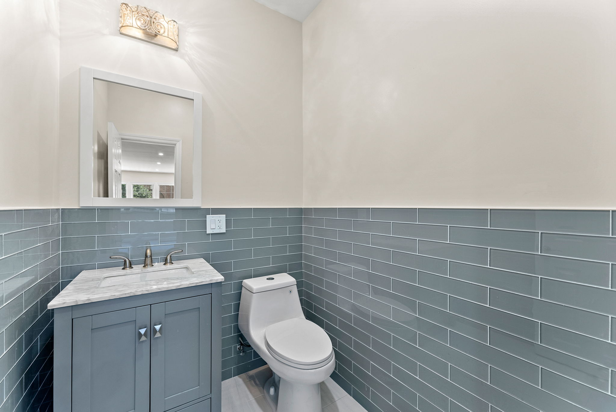 217 Butler Street, Unit 1 Brooklyn, NY 11217 - Photo 9 of 10 a bathroom with a sink a toilet and mirror