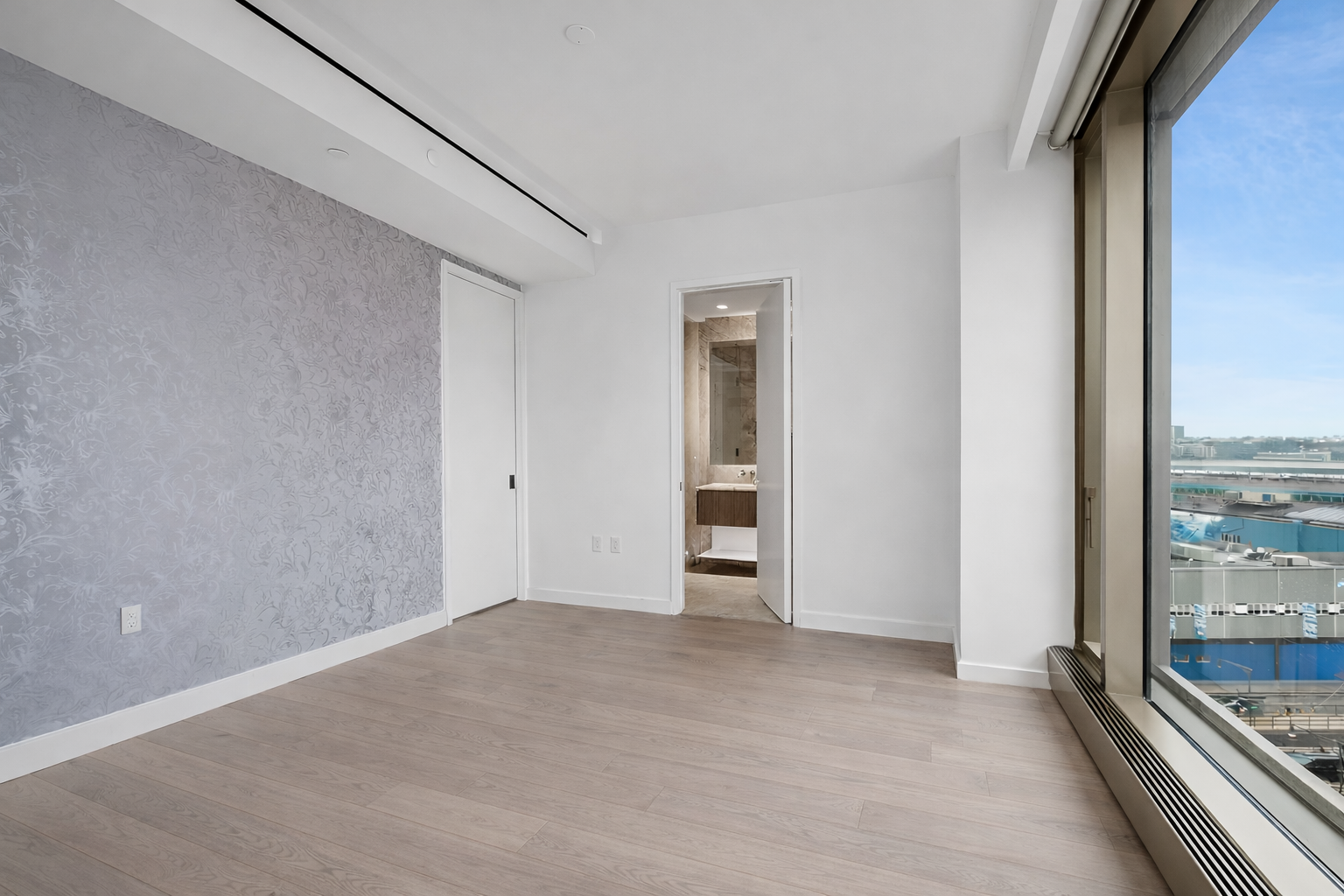 500 West 18th Street, Unit W9D Manhattan, NY 10011 - Photo 4 of 6 a view of an empty room with a window