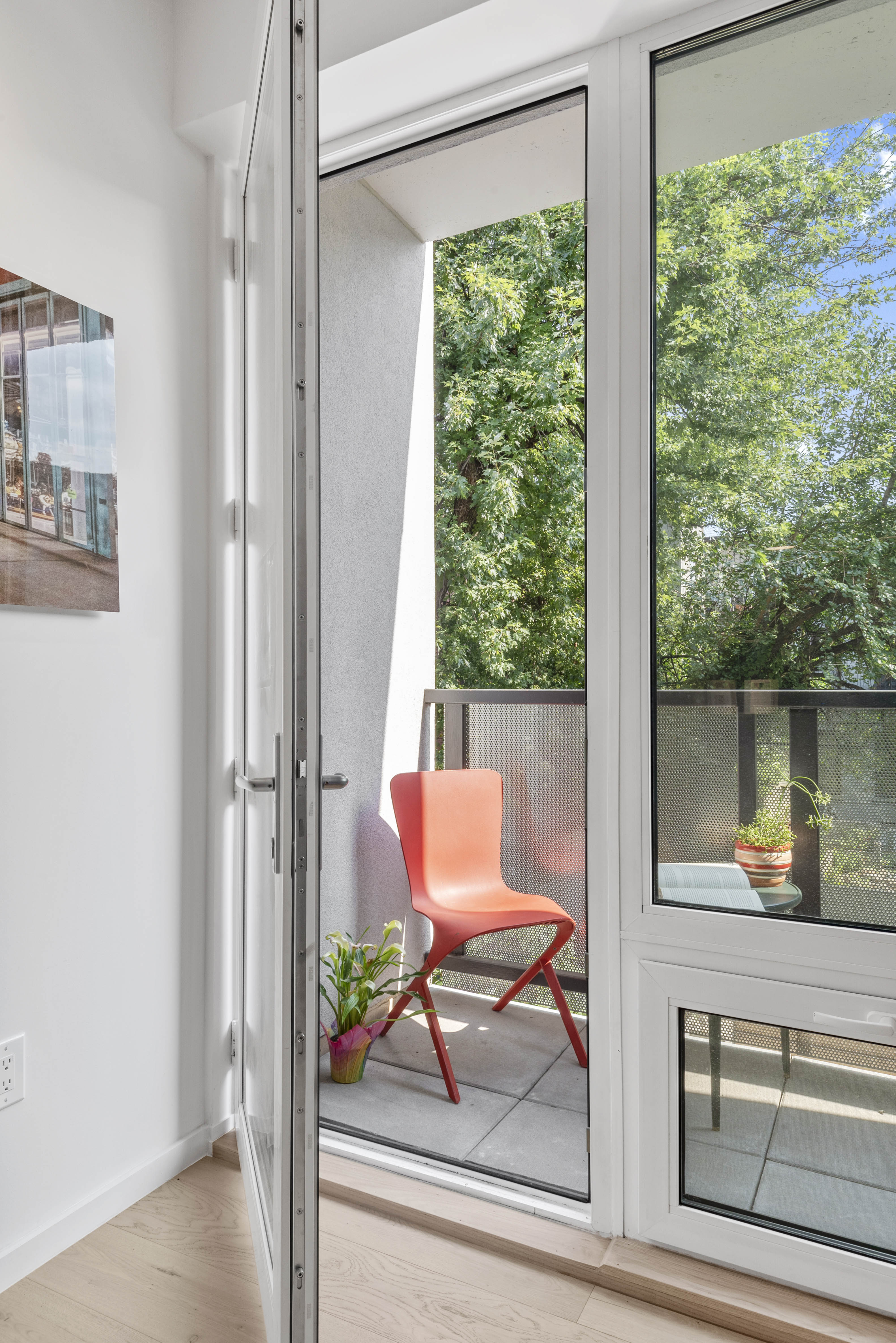 702 Hancock Street, Unit 2B Brooklyn, NY 11233 - Photo 2 of 14 a living room with furniture and a window