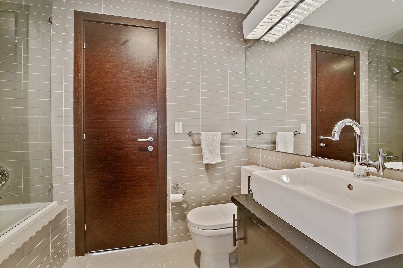 150 Myrtle Avenue, Unit 806 Brooklyn, NY 11201 - Photo 8 of 22 a bathroom with a sink a toilet and shower